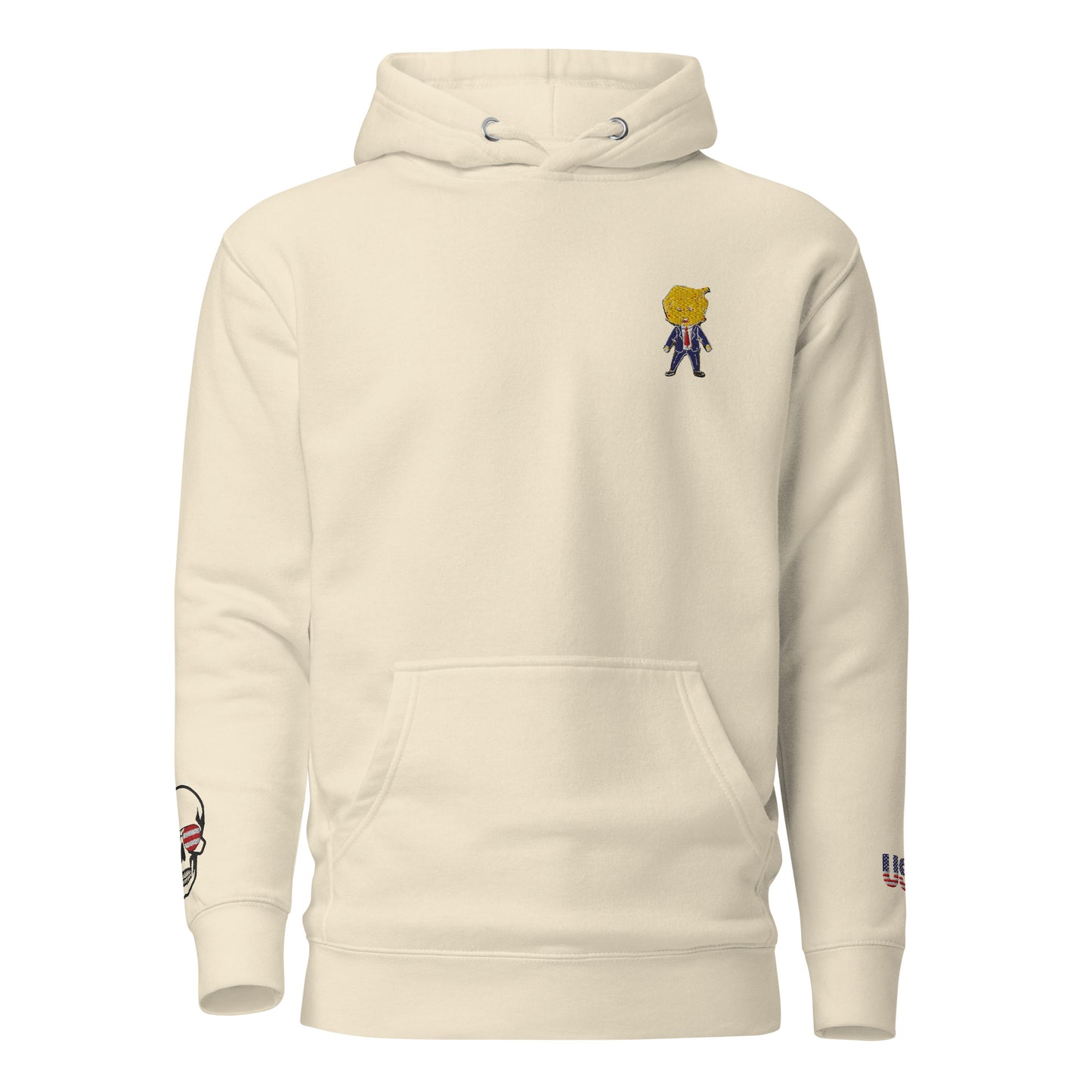 Front view of oatmeal heather Happy Trump embroidered hoodie, chibi Trump figure, skull USA sleeve patch