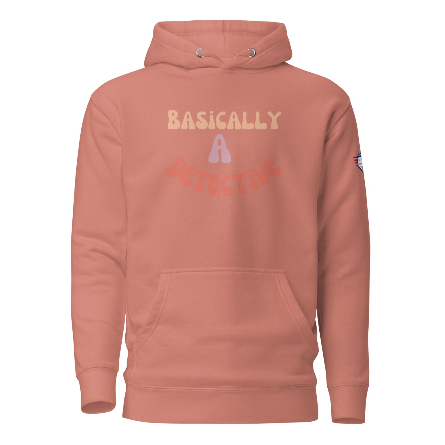Front view of coral unisex hoodie with "BASICALLY A DETECTIVE" in bubbly yellow-pink letters and blue flag patch on sleeve