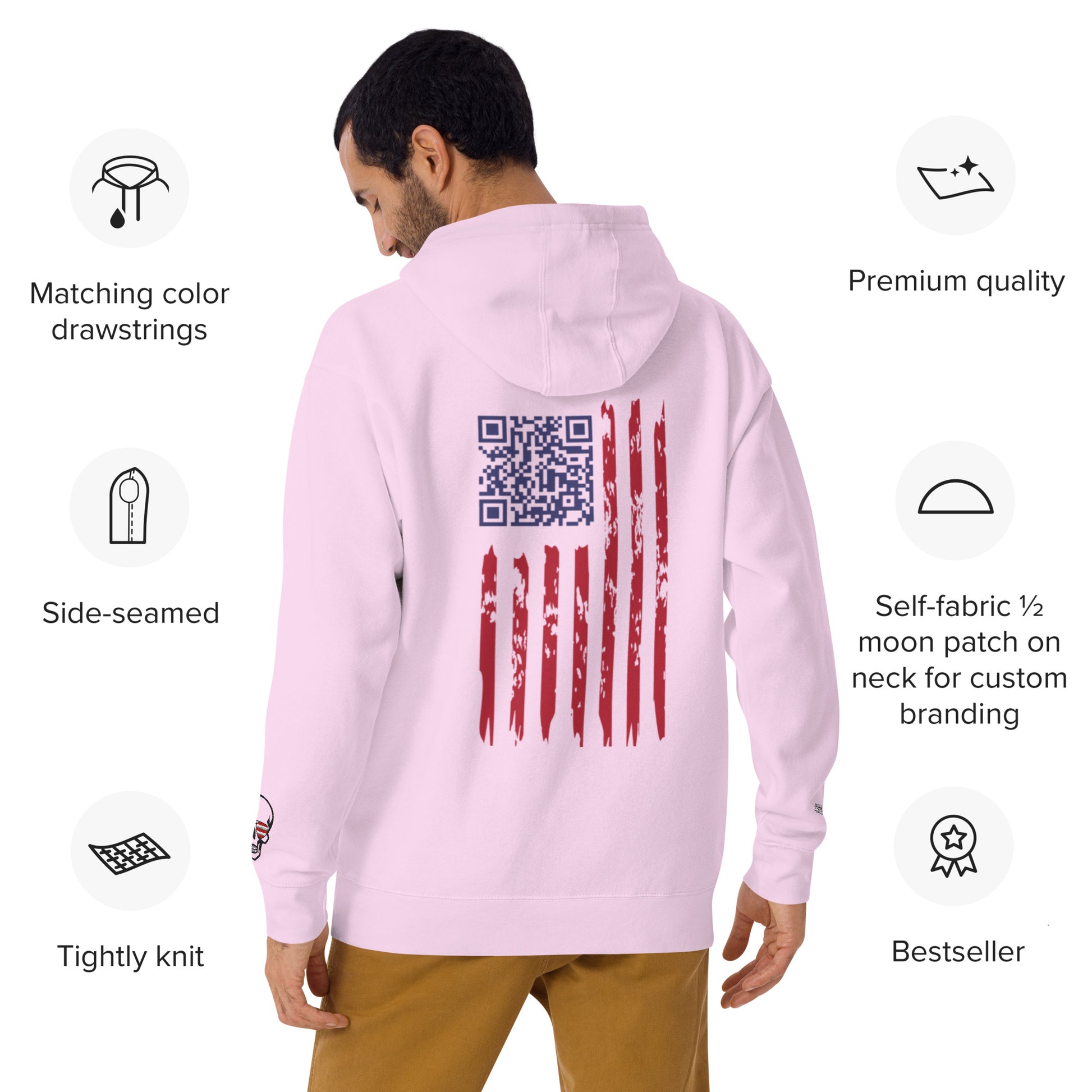 Redhead model posing sideways in sky blue hoodie, showcasing back's rugged flag embroidery & QR detail