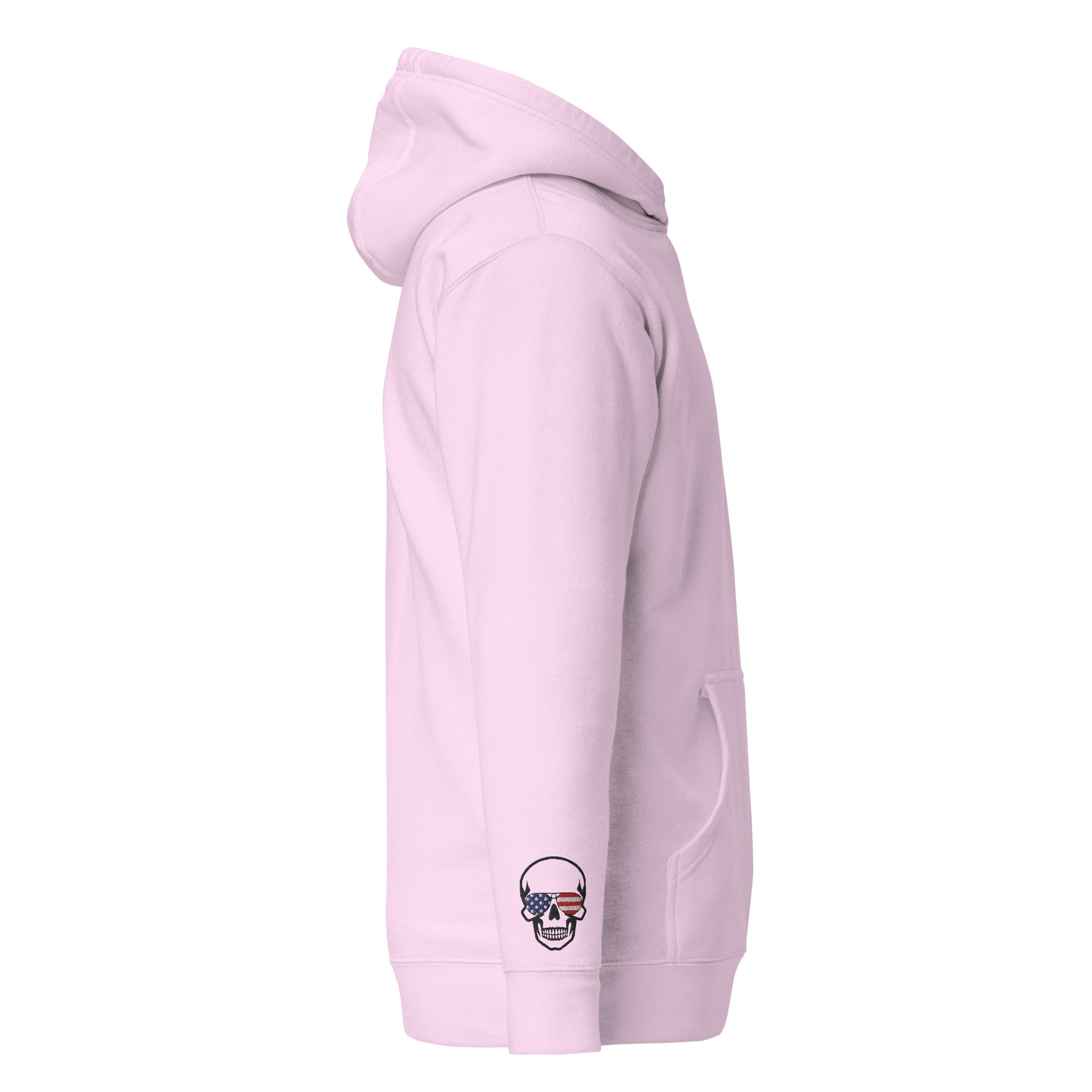 Left side view of light pink hoodie featuring pouch pocket and skull US flag embroidery