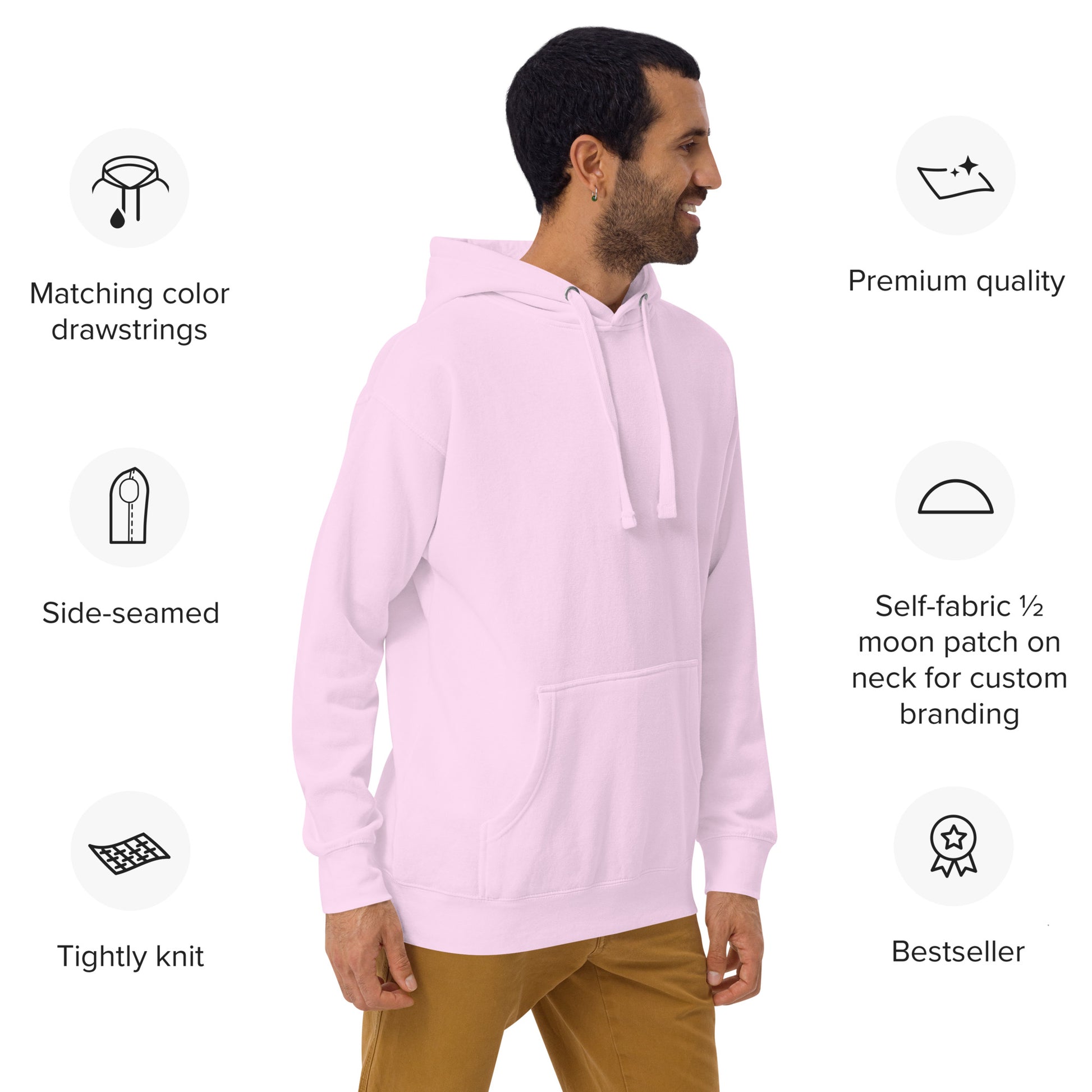 Male model in motion wearing light pink Happy Trump Hoodie from side angle, cozy fit with feature icons overlaid