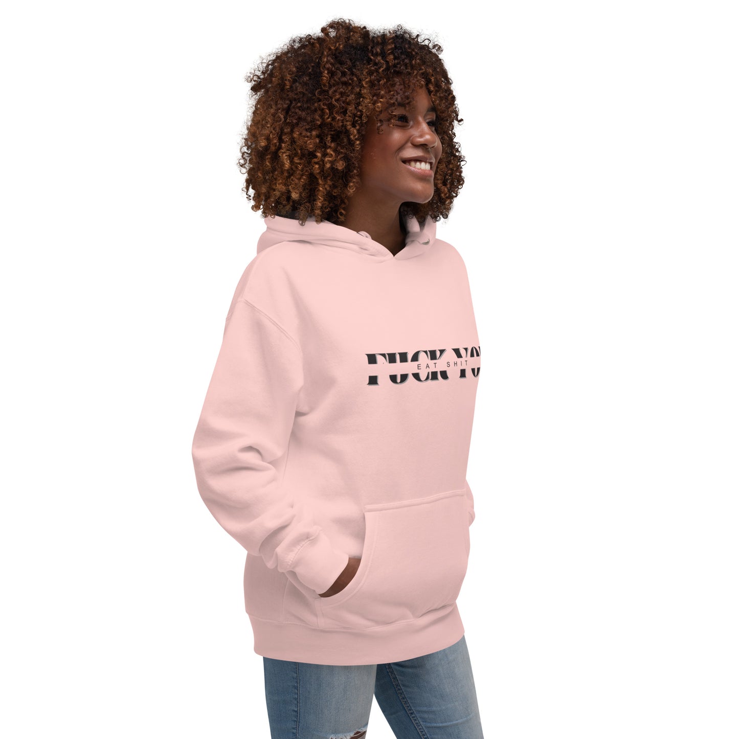 Curly-haired female model in light pink hoodie, left-front side with "F*ck You" print and flag patch