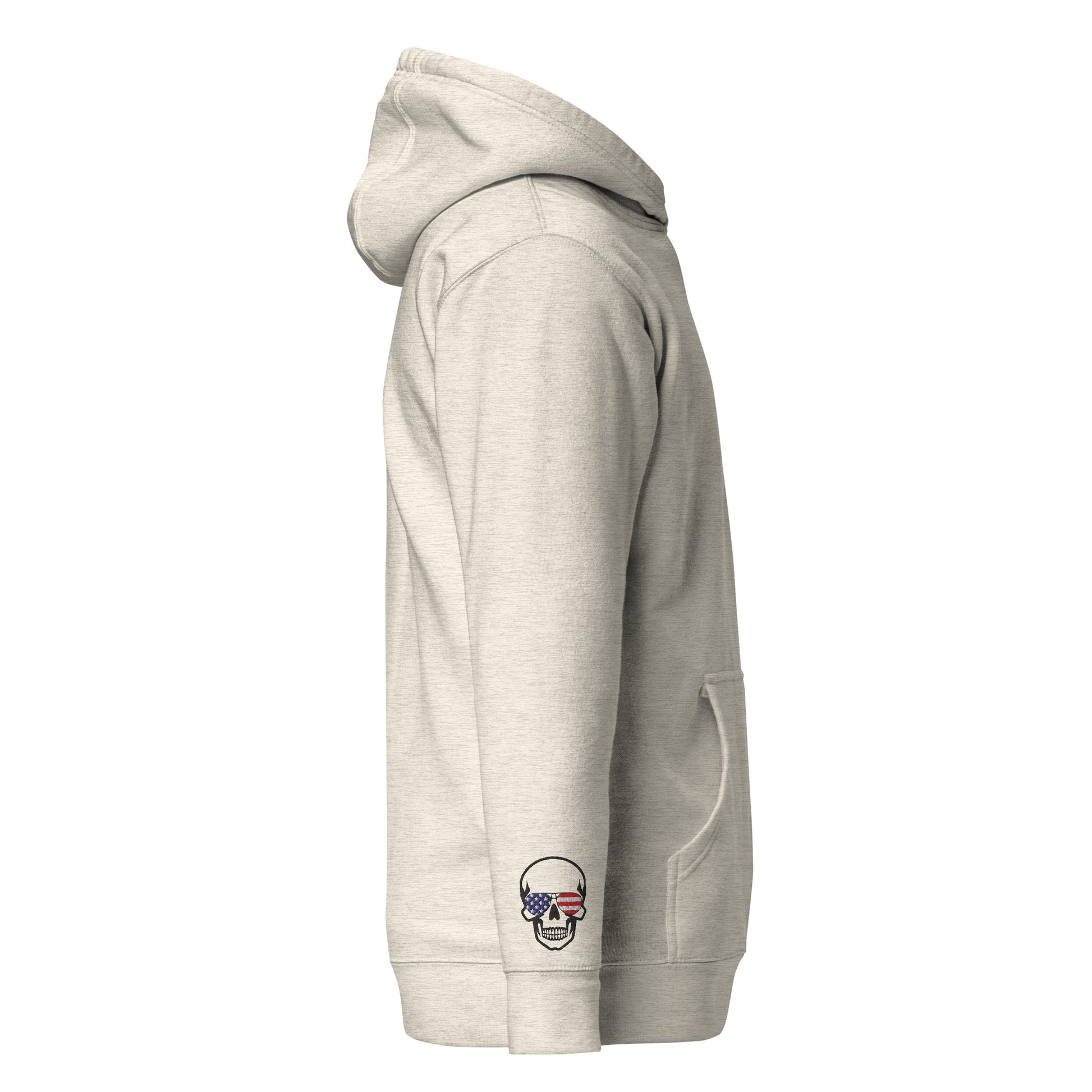 Left side view of oatmeal heather hoodie with pouch pocket, skull US flag sleeve embroidery