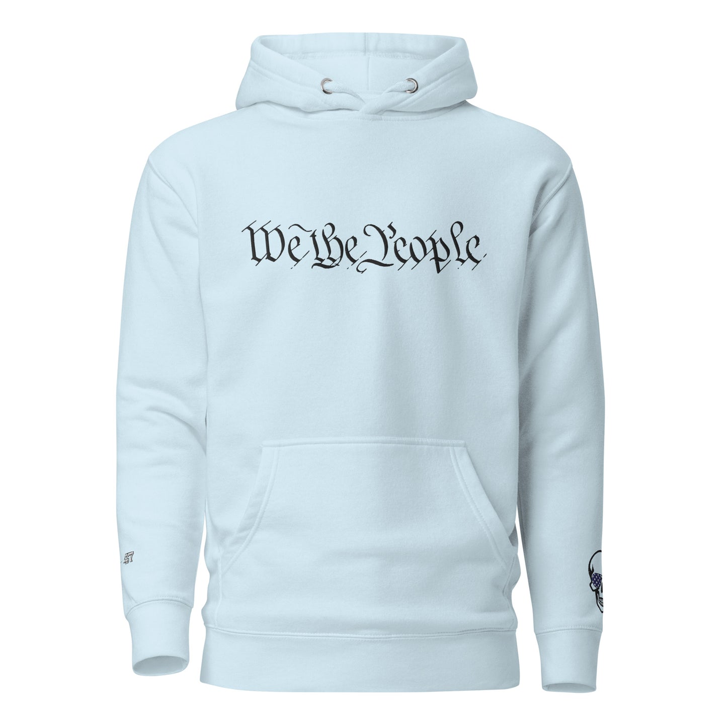 Front view of sky blue unisex hoodie with bold arched "We the People" black embroidery, skull sleeve patch