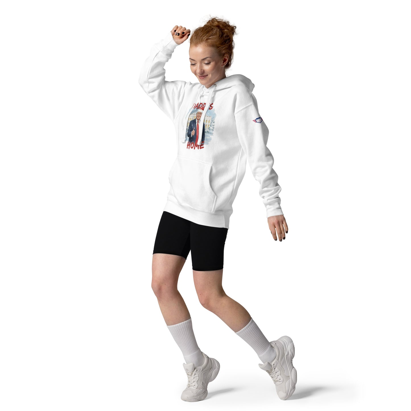Redhead model dancing in white "Daddy’s Home" Trump Santa hoodie, black shorts, white kicks