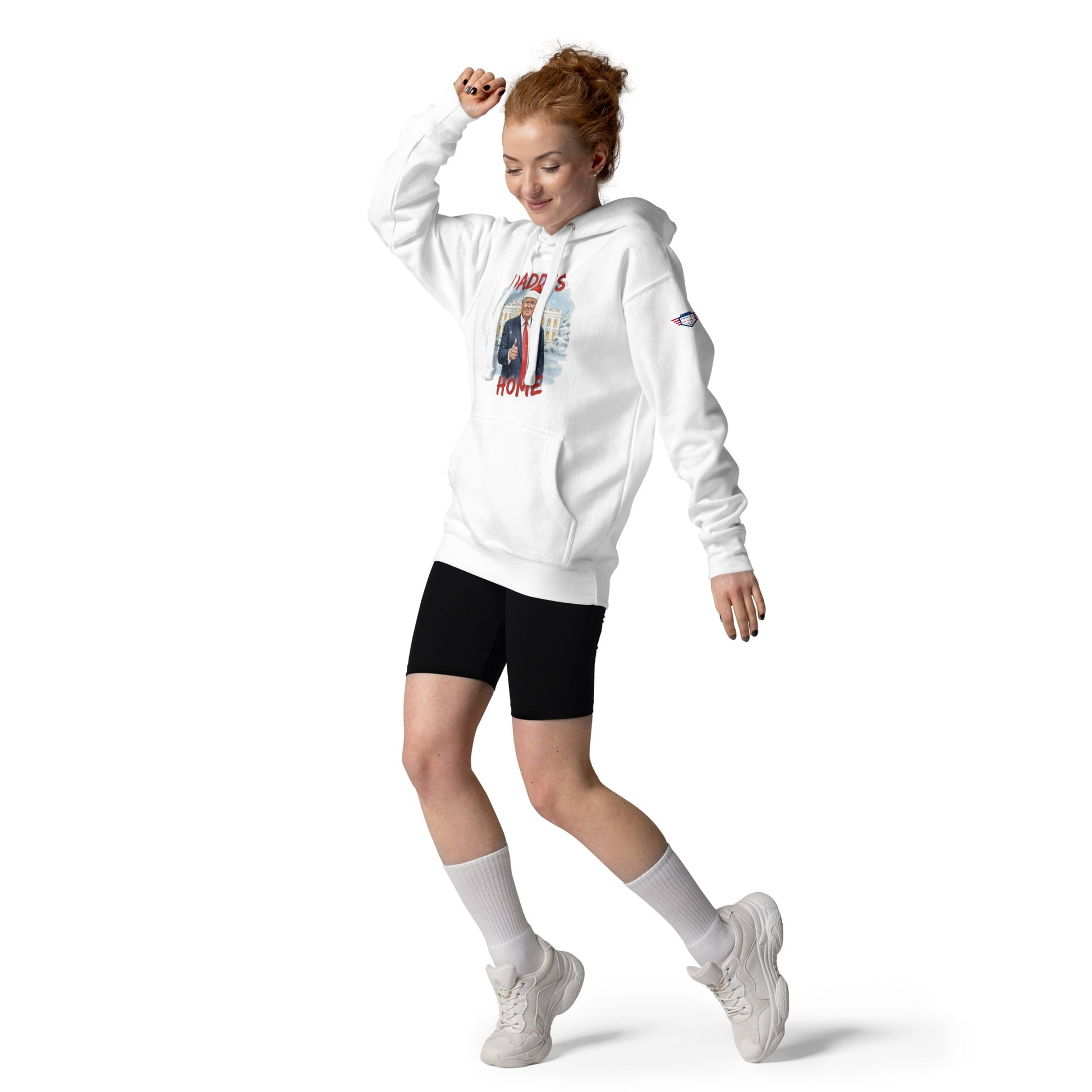 Redhead woman dancing in white Daddy’s Home Trump Santa Christmas hoodie, dynamic front lifestyle shot