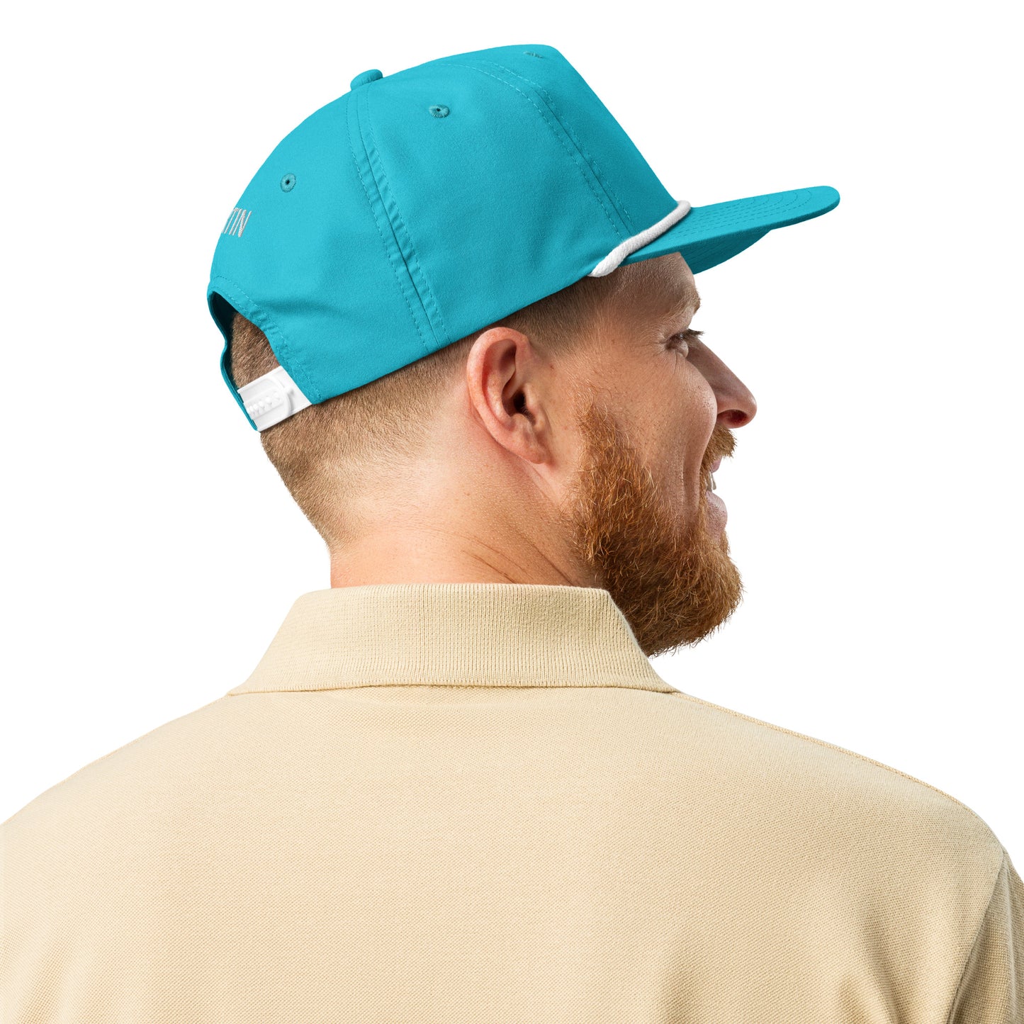 Rear side view of bearded model wearing turquoise golf rope cap with white rope bill, beige polo