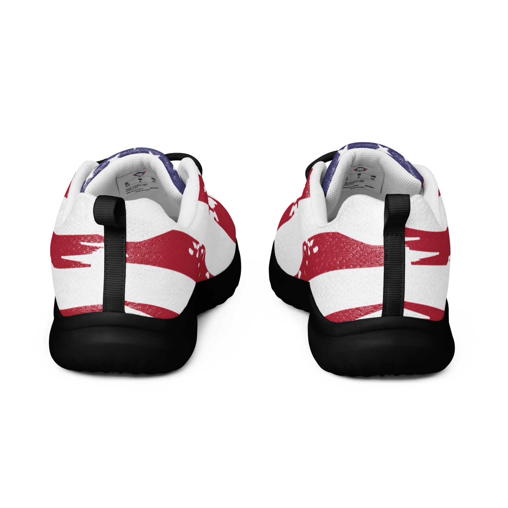 Back view of white USA men's shoes heels facing camera, red splatter stripes, blue flag pulls, black outsole grip