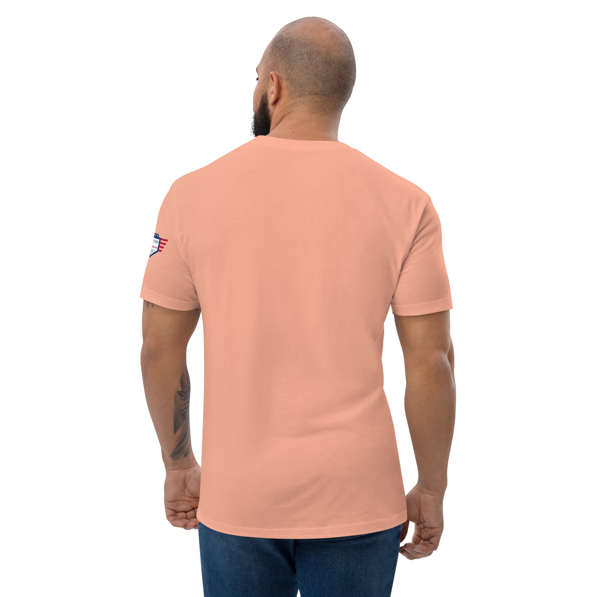 Plain back of Desert Pink fitted shirt on model in jeans, subtle USA flag on sleeve