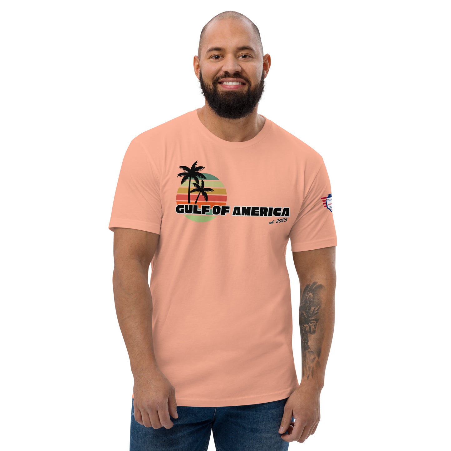 Bearded dude vibes in Desert Pink Gulf of America tee, front view with retro palm sunset and "GULF OF AMERICA" print, flag patch