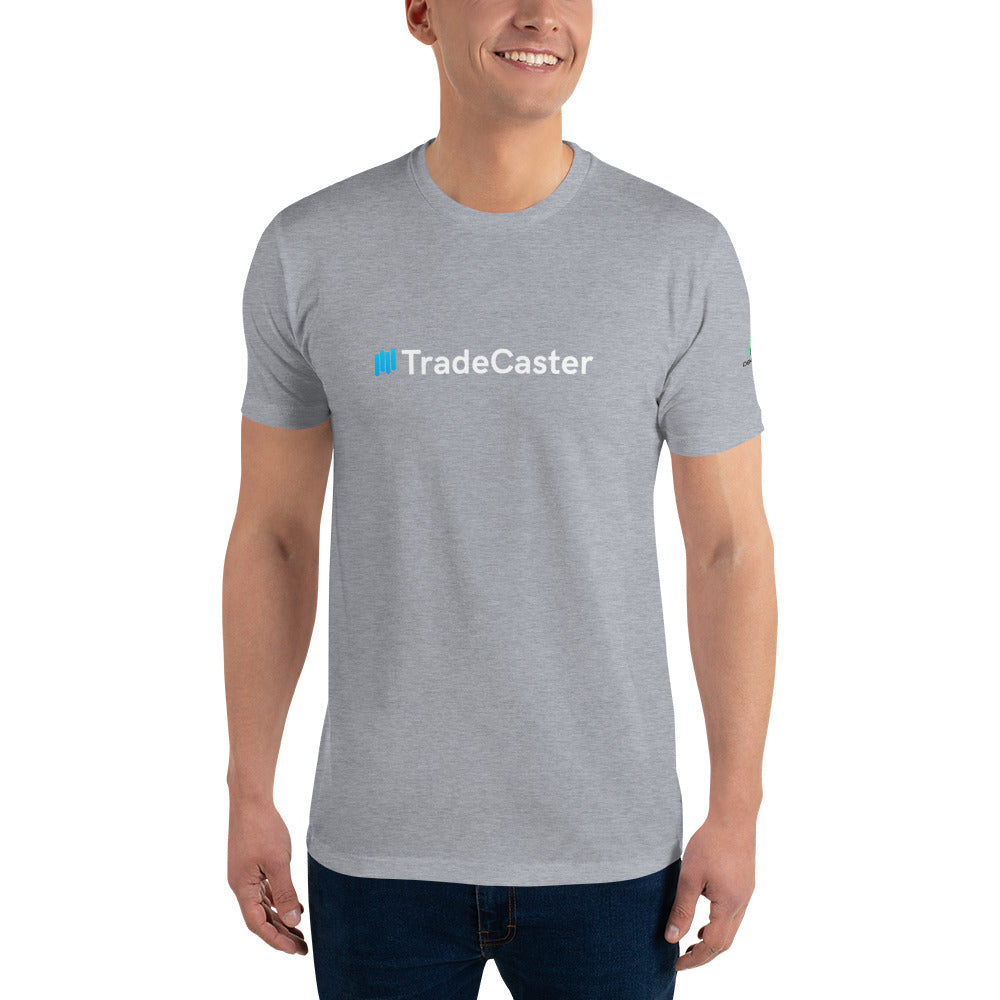 Front view of smiling model in fitted heather grey short-sleeve tee with "#TradeCaster" text in teal hash and white