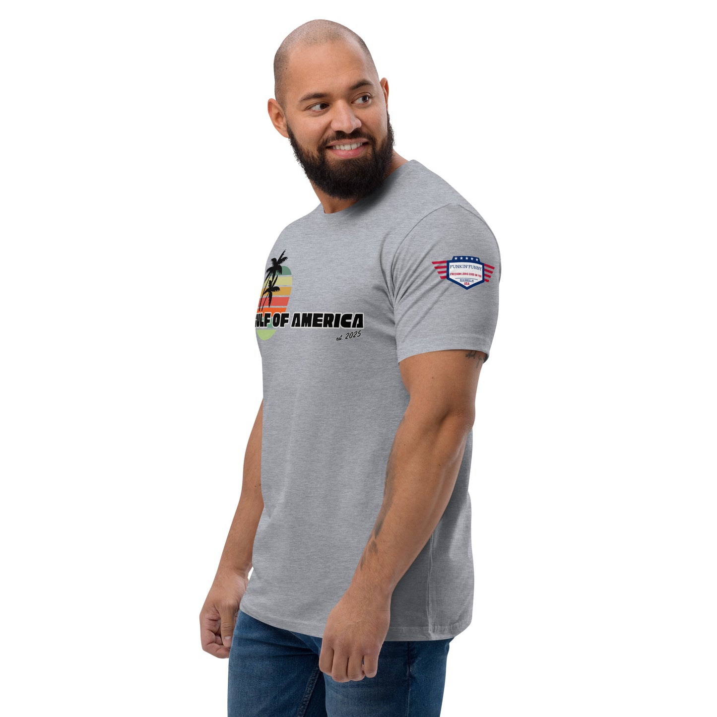 Right side view of smiling model in heather gray Gulf of America tee, partial retro palm print and flag