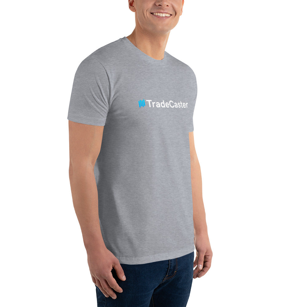 Right-side profile of model in snug heather grey tee with partial "#TradeCaster" print visible