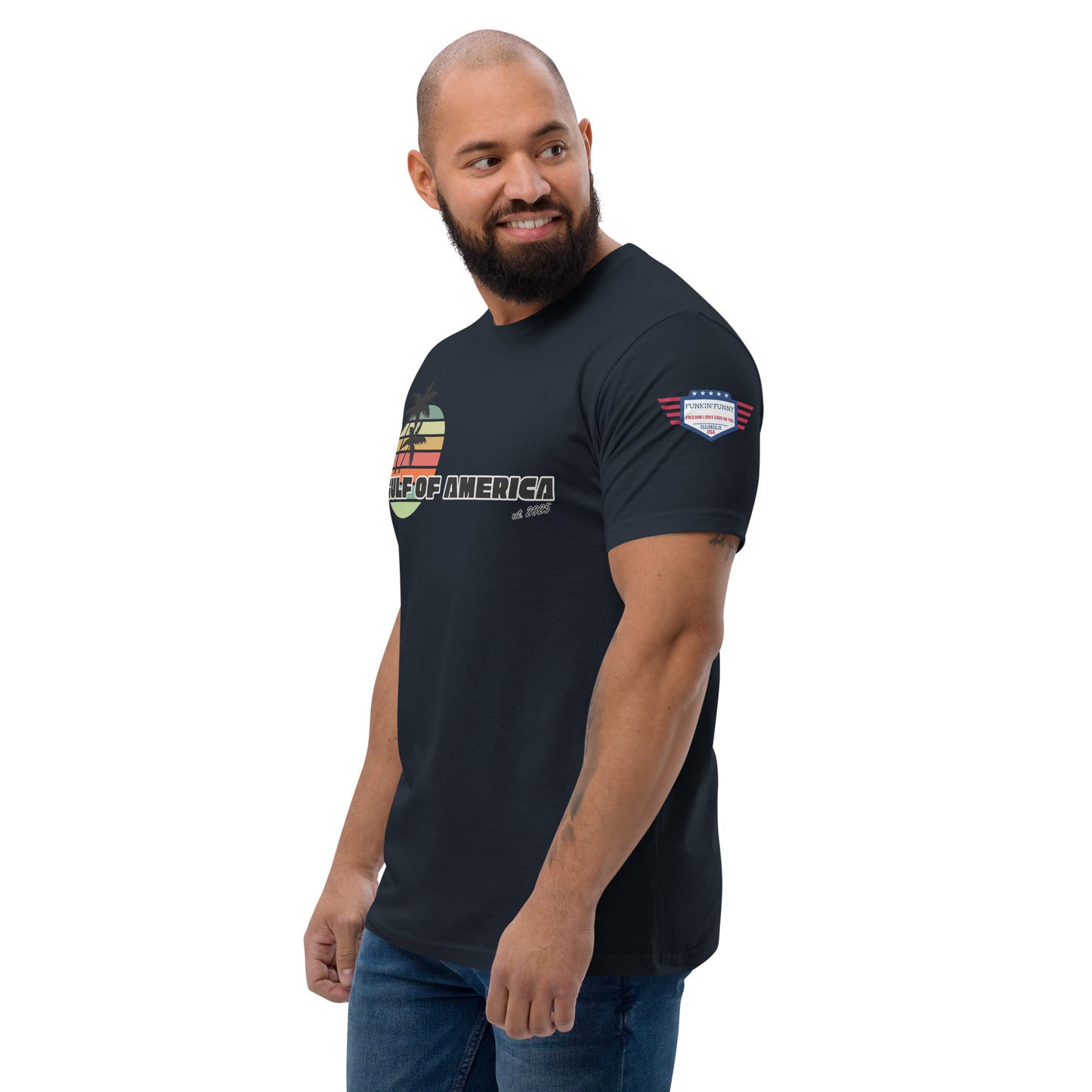 Right side view of smiling model in navy Gulf of America tee, partial palm tree graphic and flag patch