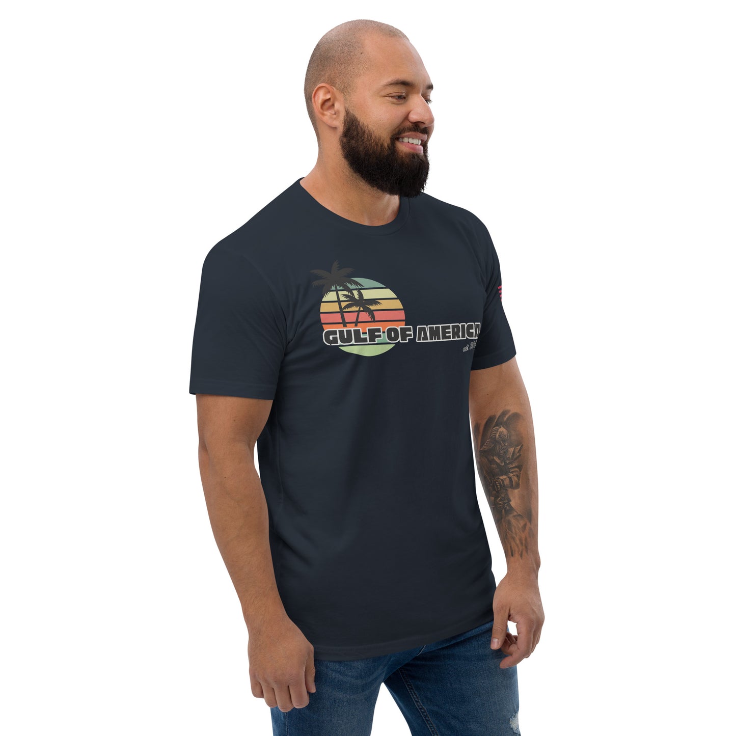 Left side view of grinning model in midnight navy fitted tee, edge of retro sunset design