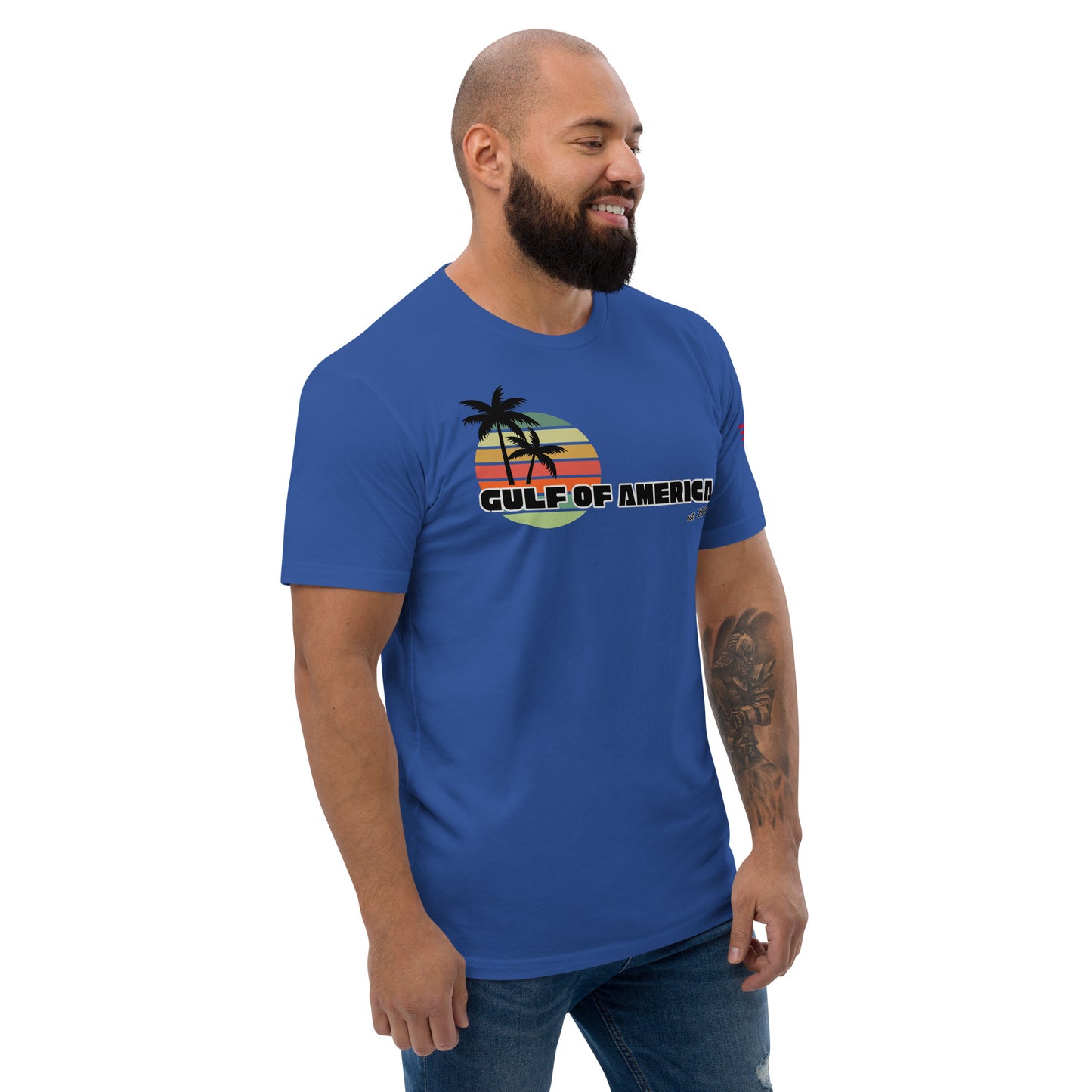 Right side view of royal blue fitted shirt on smiling model, black palm tree and "GULF OF AMERICA" peeking out