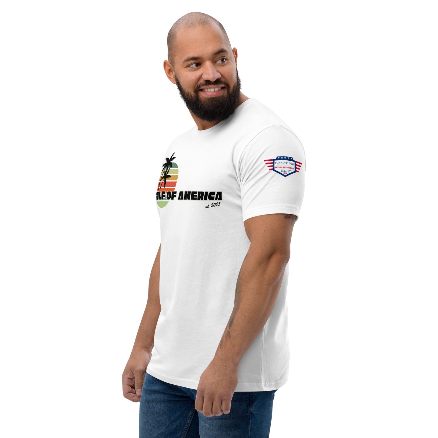 Right side view of smiling model in white Gulf of America fitted tee, partial palm sunset print and flag patch