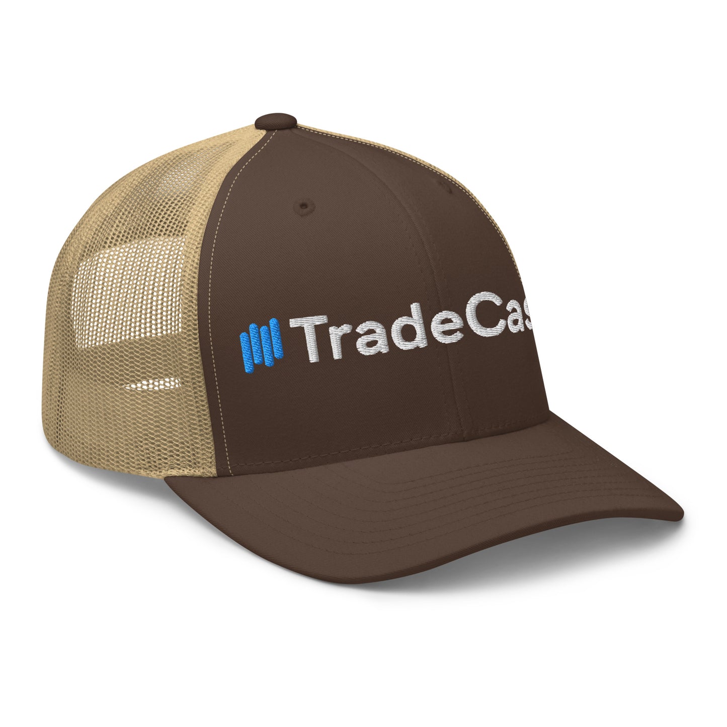 Front-right view of dark brown TradeCaster trucker cap with tan mesh back, blue bars and white embroidery popping