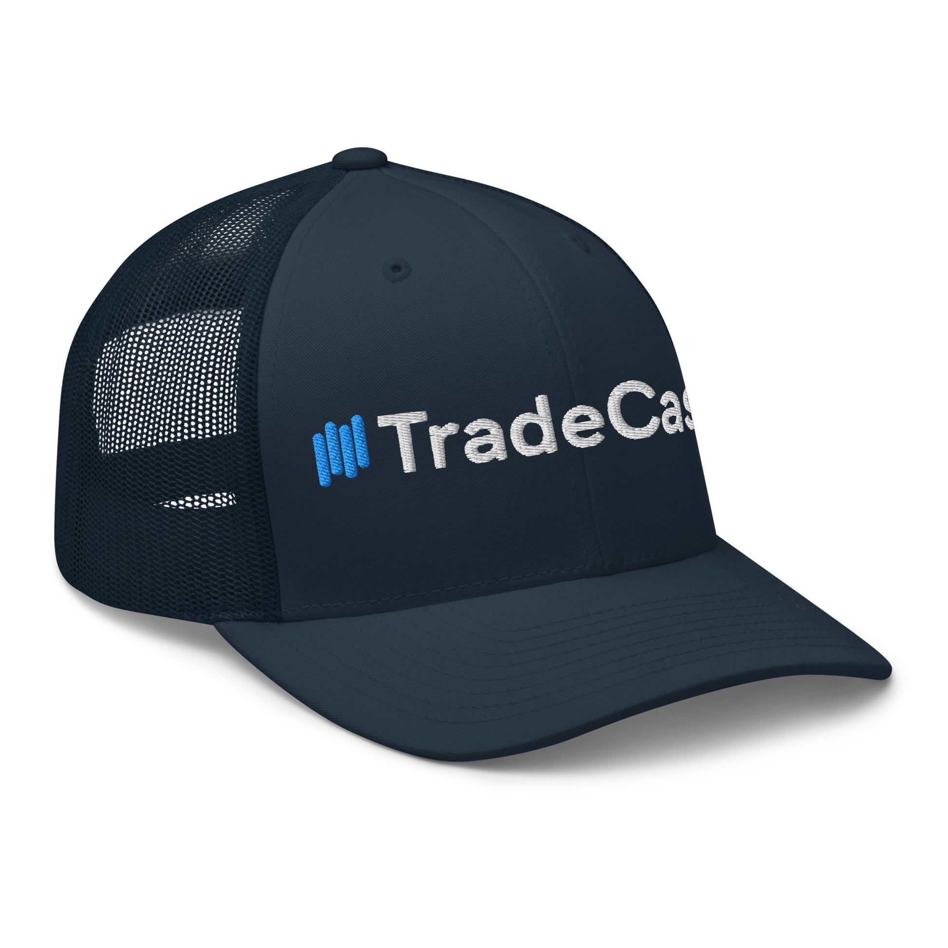 3/4 front-left view of navy trucker cap with full "||TradeCaster" 3D puff embroidery, dark mesh back