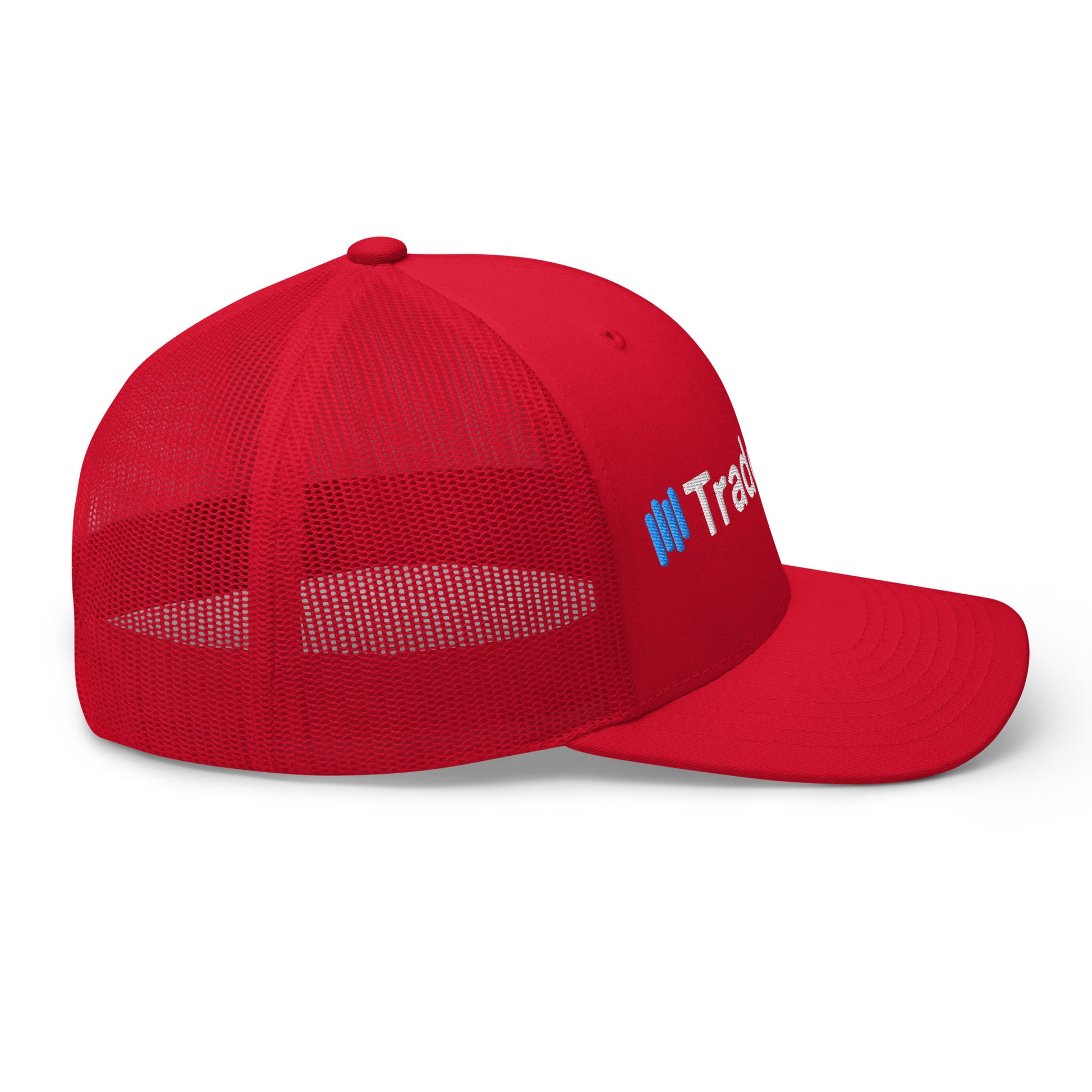 Left side angle on red trucker cap showing partial white "TradeCaster" embroidery