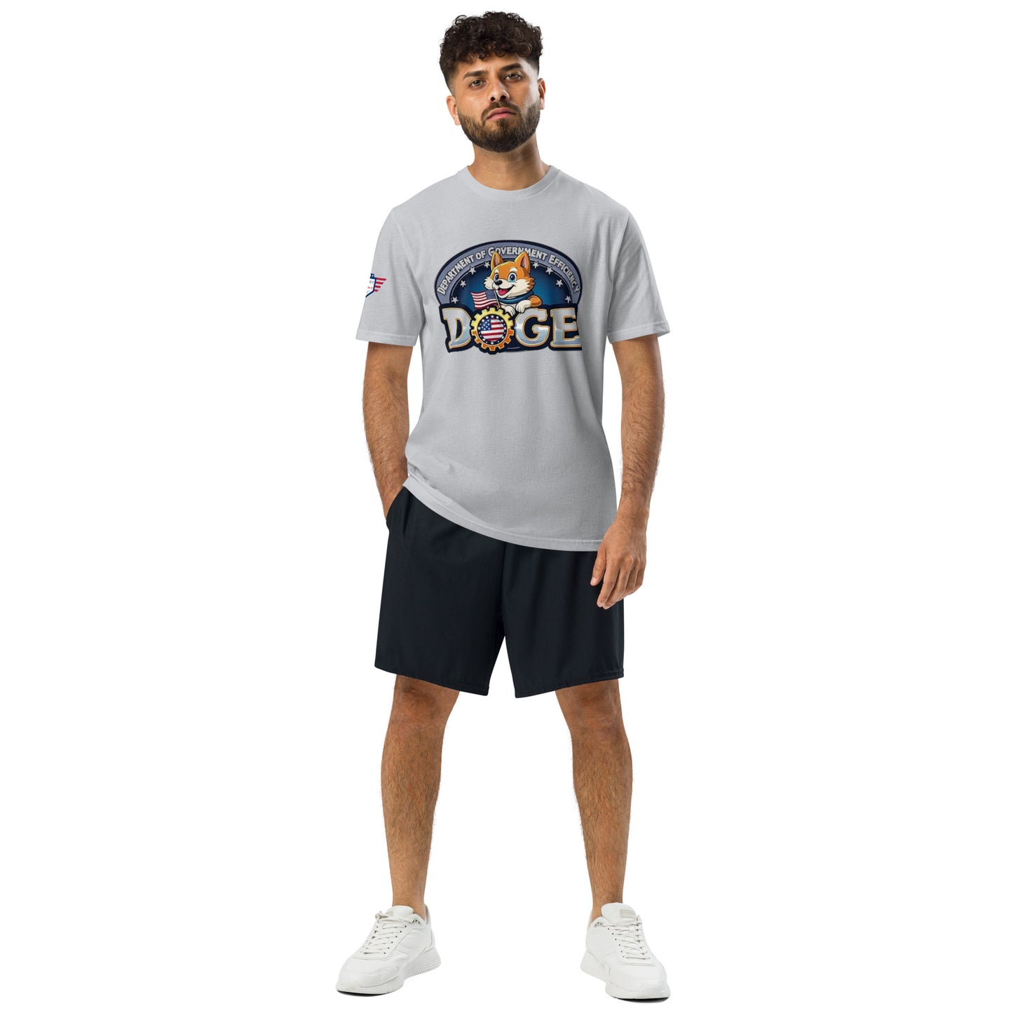 Front view of male model in grey DOGE "Department of Government Efficiency" Under Armour tee, shorts, and sneakers