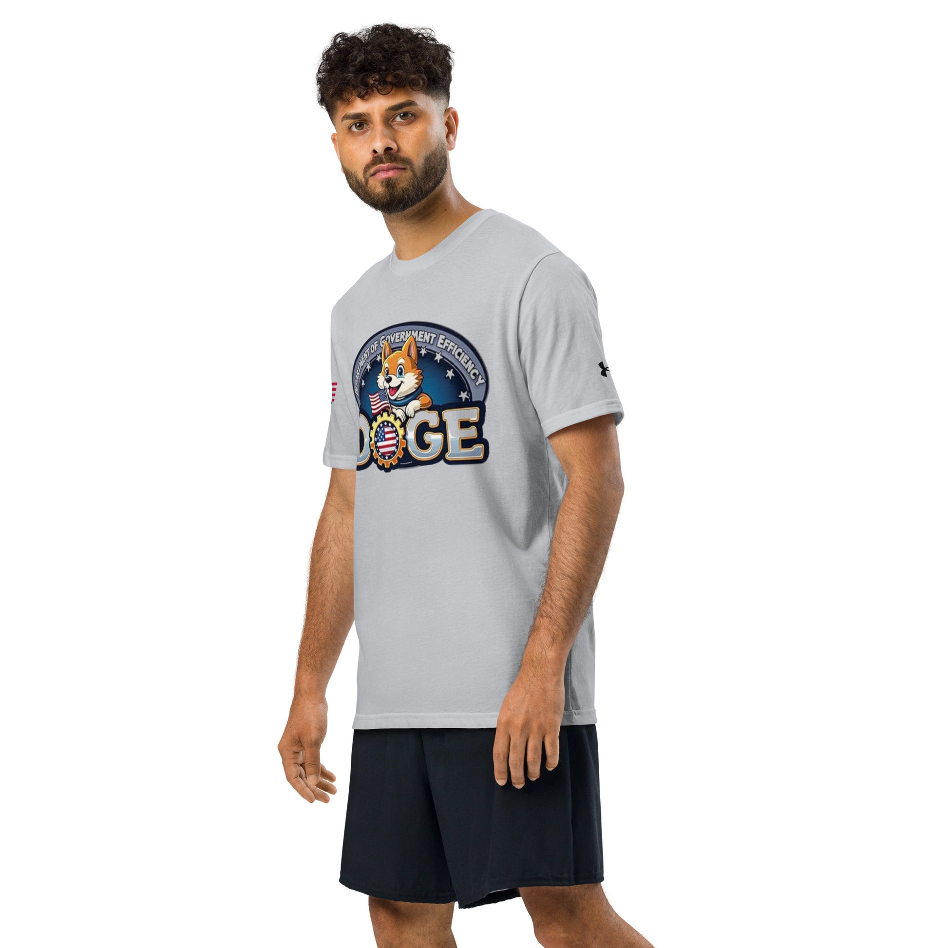 Side view of male model in grey DOGE "Government Efficiency" Under Armour tee and black shorts