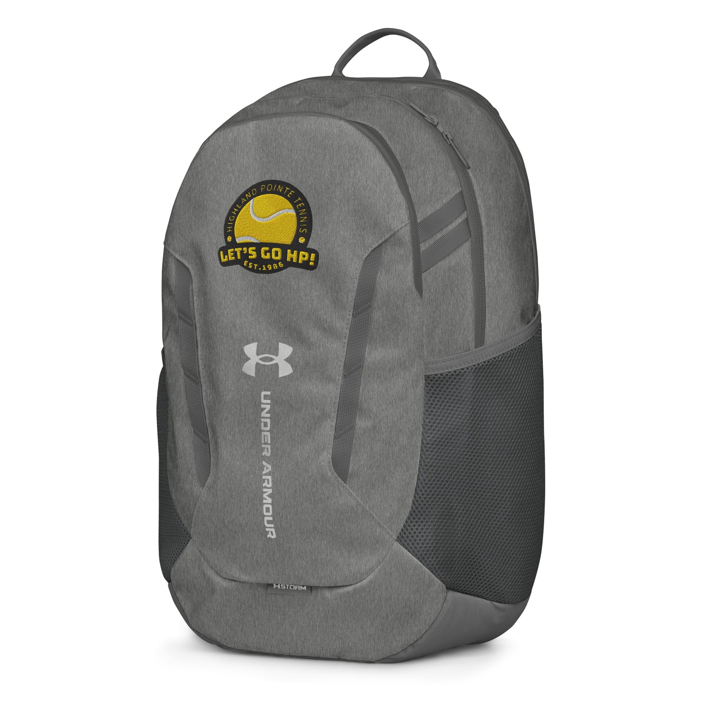Three-quarter front view of heather gray Under Armour backpack with bold yellow "Let's Go HP!" patch and tennis ball motif