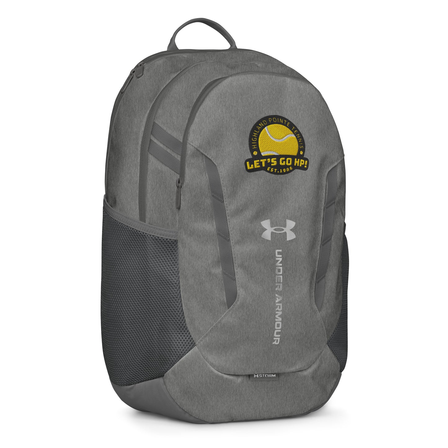Angled front-left view of heather gray Under Armour backpack flaunting yellow "Let's Go HP!" tennis club patch