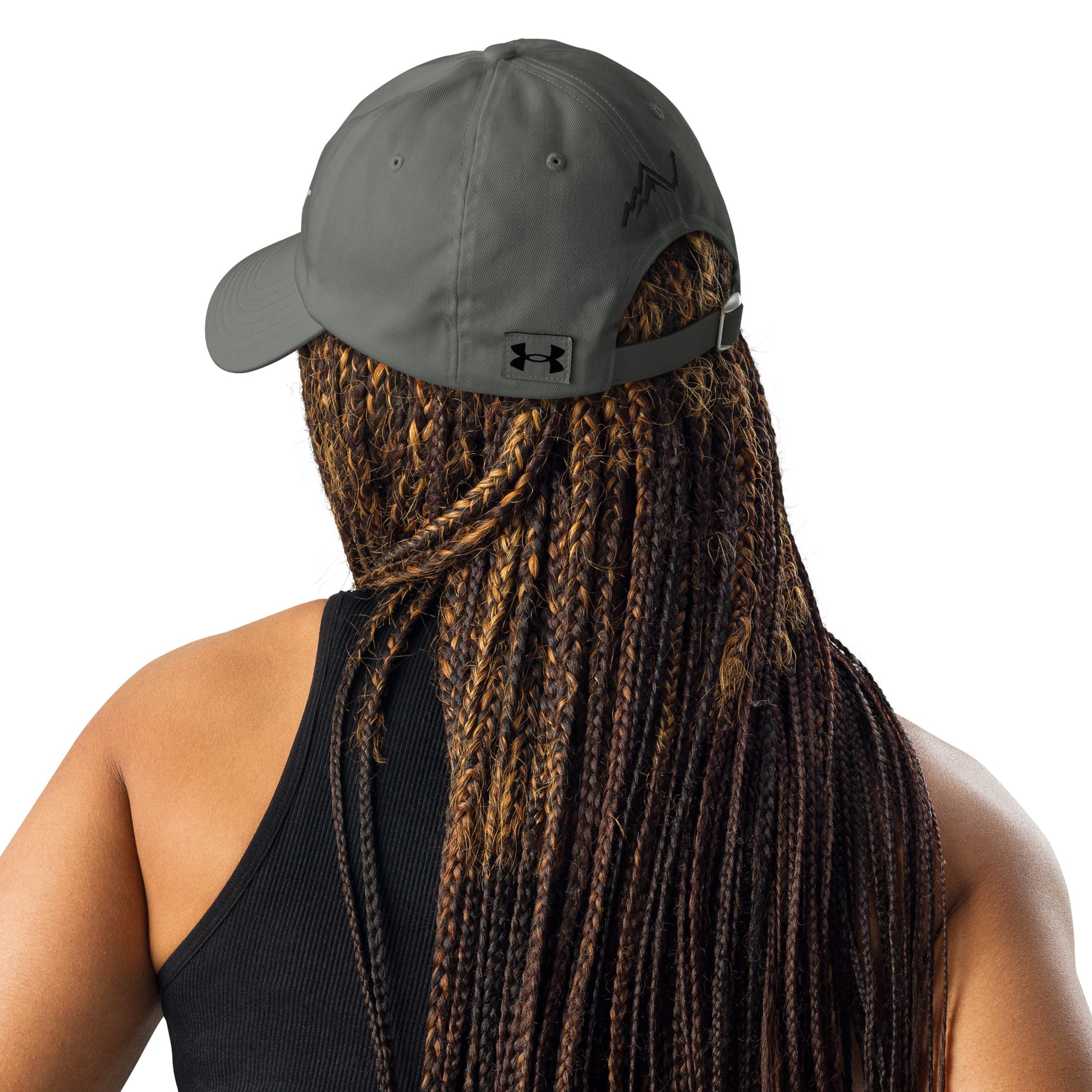 Back view on woman rocking gray Under Armour hat, black UA logo square visible, snap closure, braided hair flow