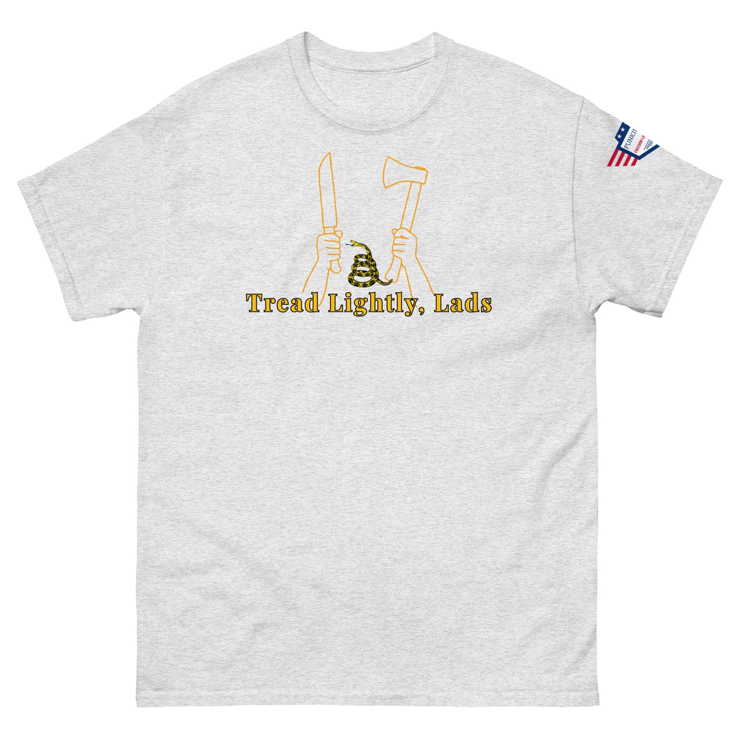Front view of light gray unisex tee with gold "Tread Lightly, Lads" print, hands gripping knife & axe around coiled Gadsden snake, US flag sleeve patch