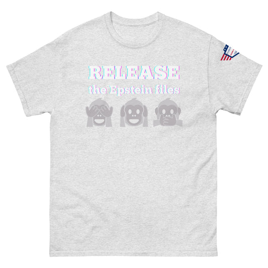 Front view of ash gray unisex t-shirt with prismatic "RELEASE the Epstein files" text, see-no-evil monkey emojis, USA flag shoulder patch