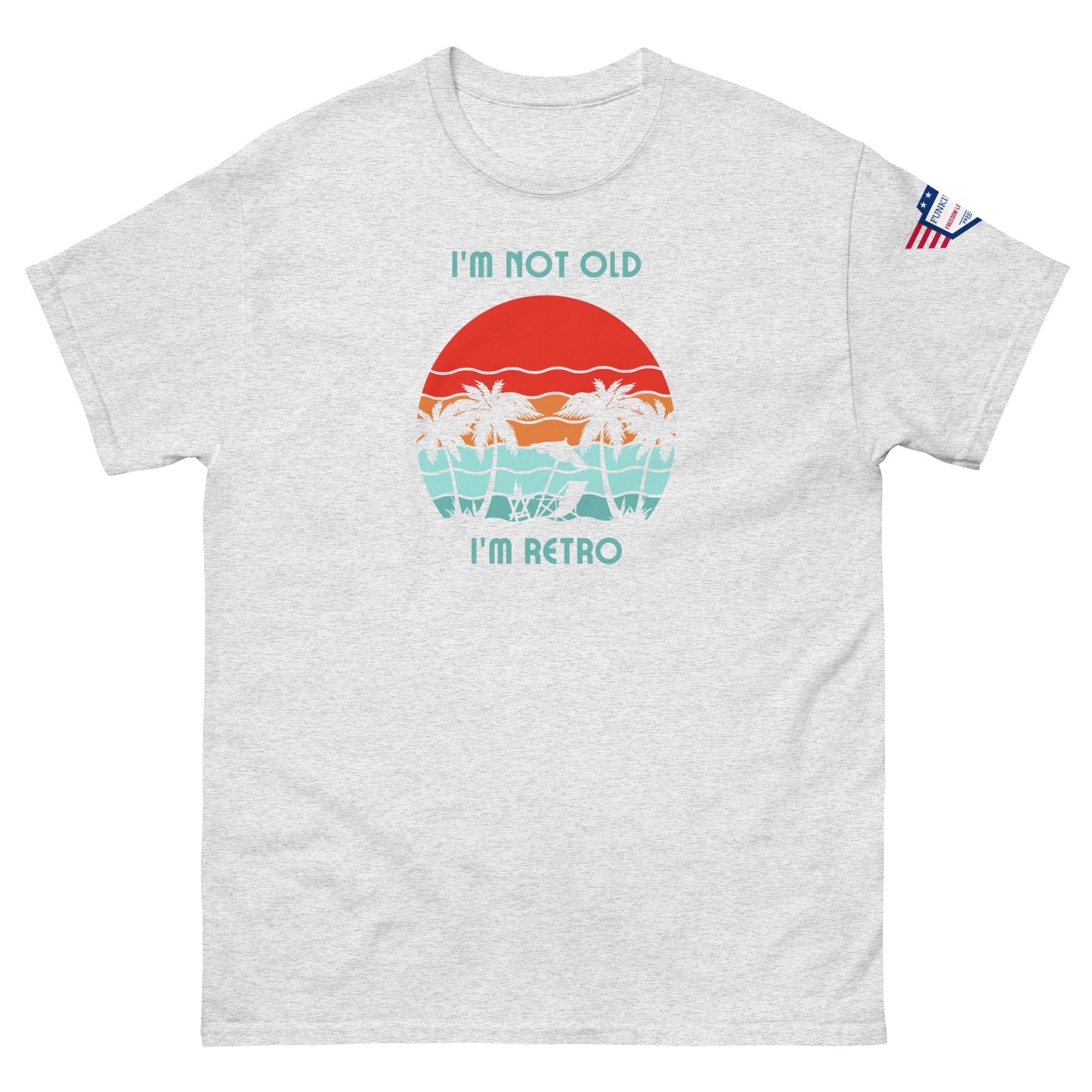 Front view of light gray unisex t-shirt with "I'm not old I'm retro" text and colorful palm sunset graphic, US flag sleeve patch