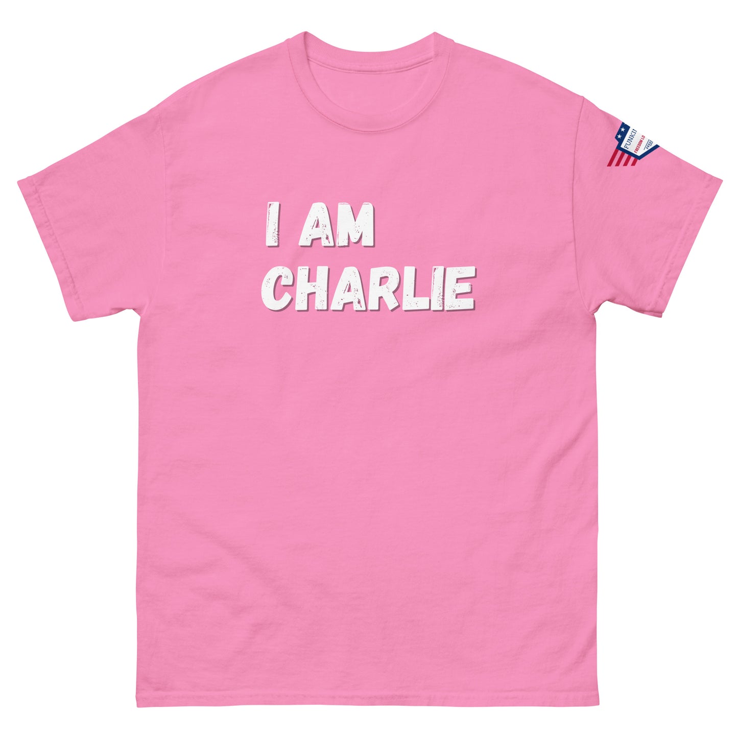 Front view of hot pink unisex tee with bold white "I AM CHARLIE" print and small American flag sleeve patch