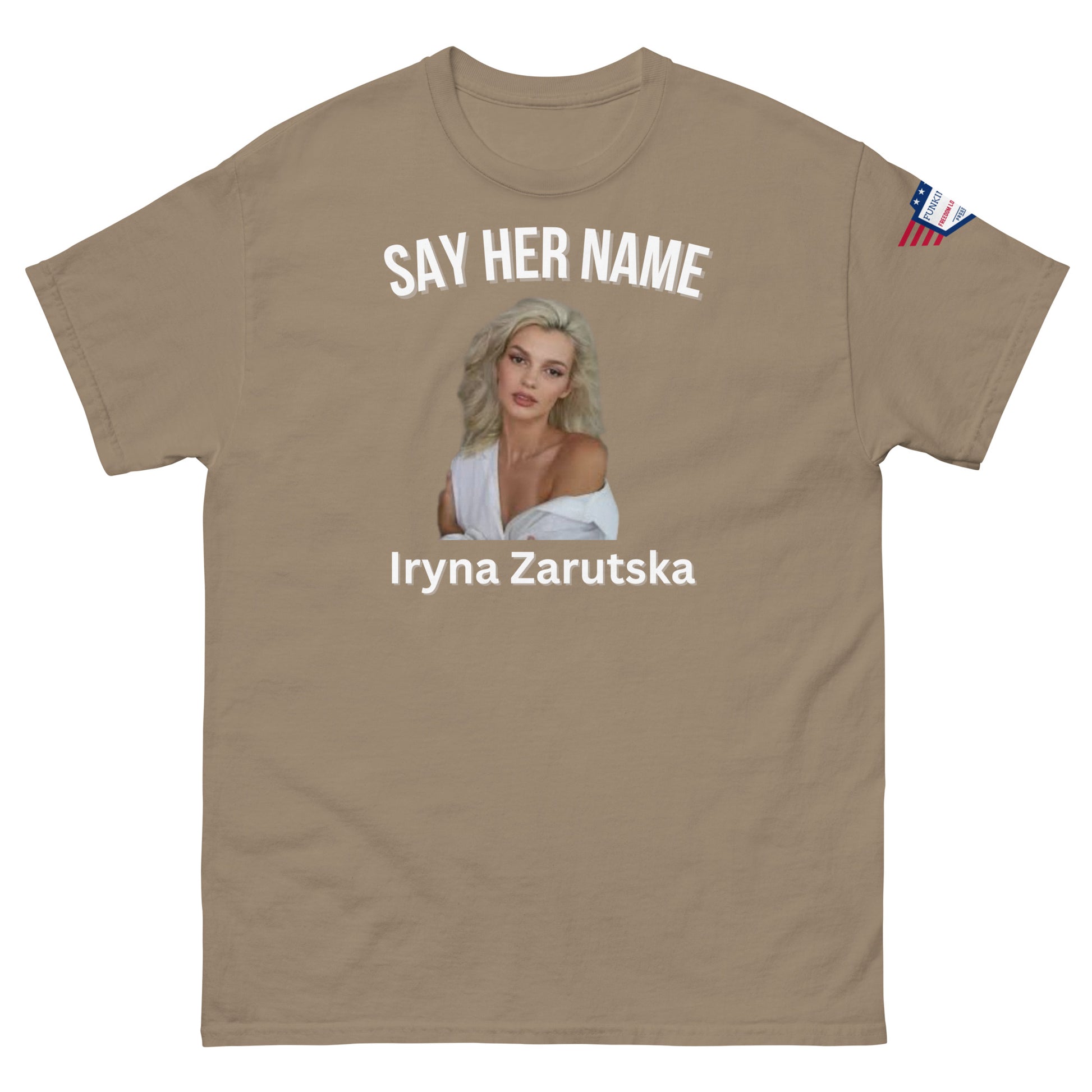 Front view of khaki "SAY HER NAME" tee showing Iryna Zaruska portrait, USA sleeve patch