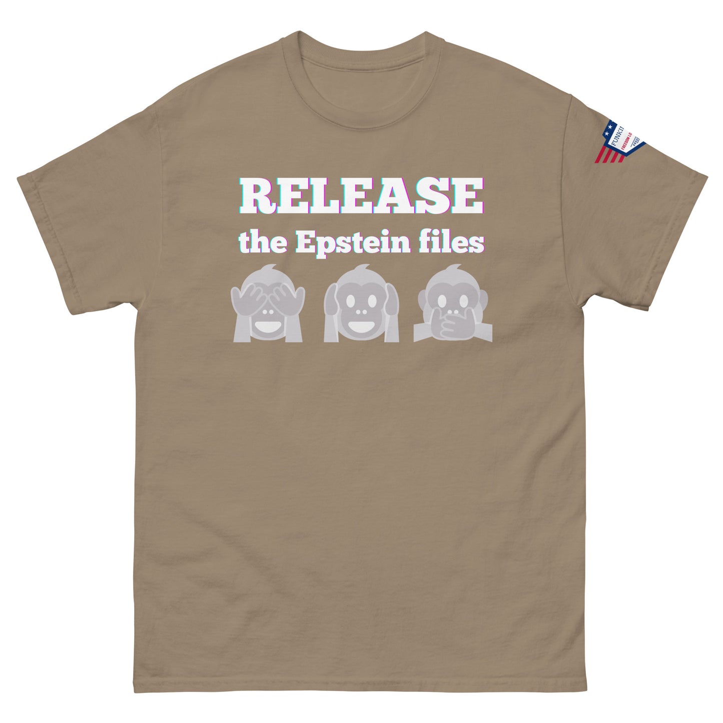 Front view of tan unisex t-shirt showing "RELEASE the Epstein files" bold print, three gray monkeys, USA flag on shoulder