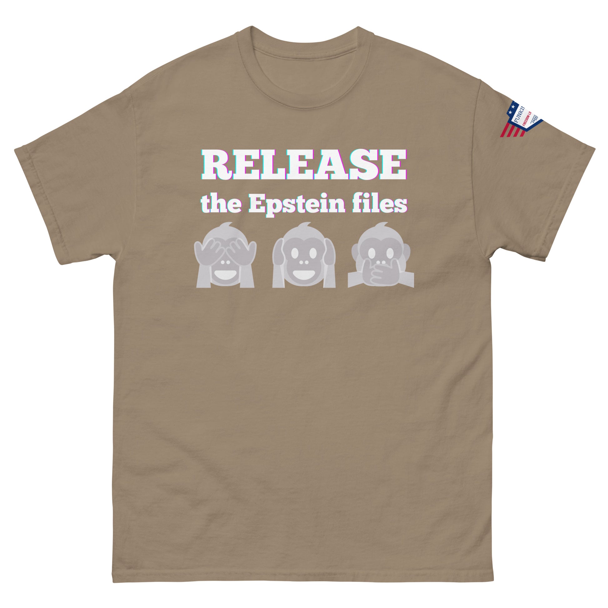Front view of tan unisex t-shirt showing "RELEASE the Epstein files" bold print, three gray monkeys, USA flag on shoulder