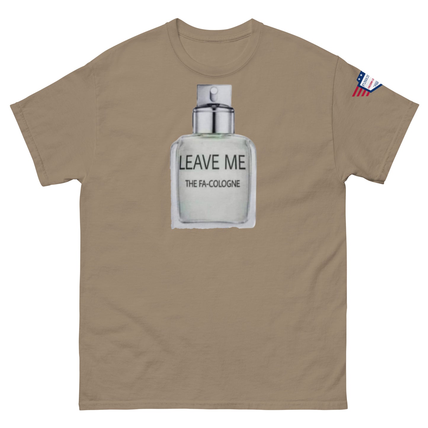 Front view of tan unisex tee showing "Leave Me The Fa Cologne" punny bottle design and USA flag patch