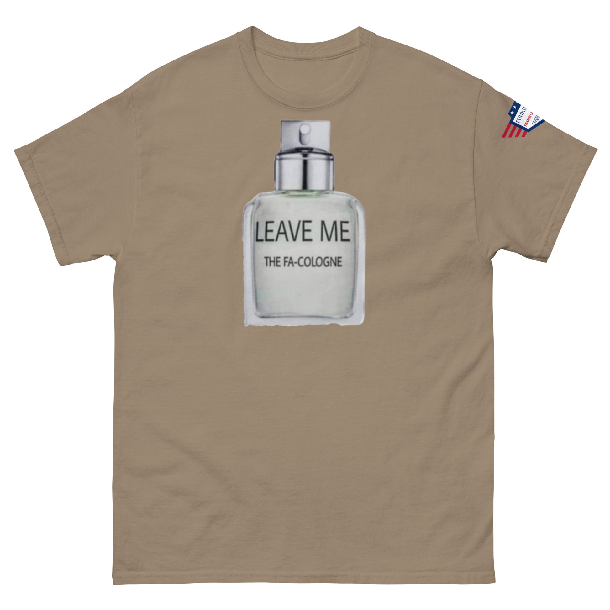 Front view of tan unisex tee showing "Leave Me The Fa Cologne" punny bottle design and USA flag patch