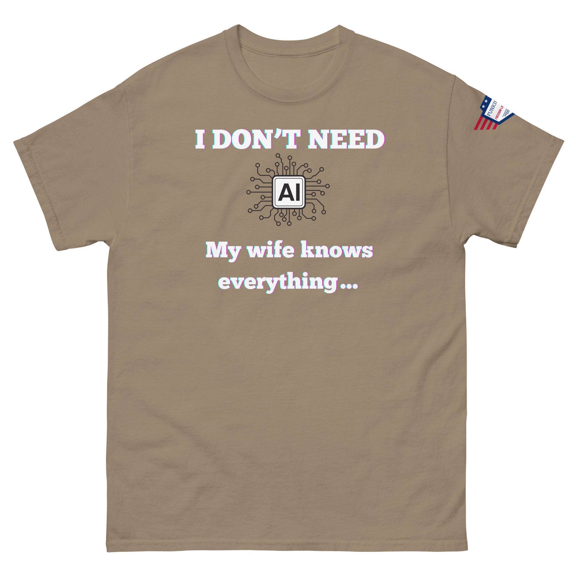 Front view of tan unisex t-shirt showing "I DON'T NEED AI My wife knows everything..." print and small USA flag on right sleeve