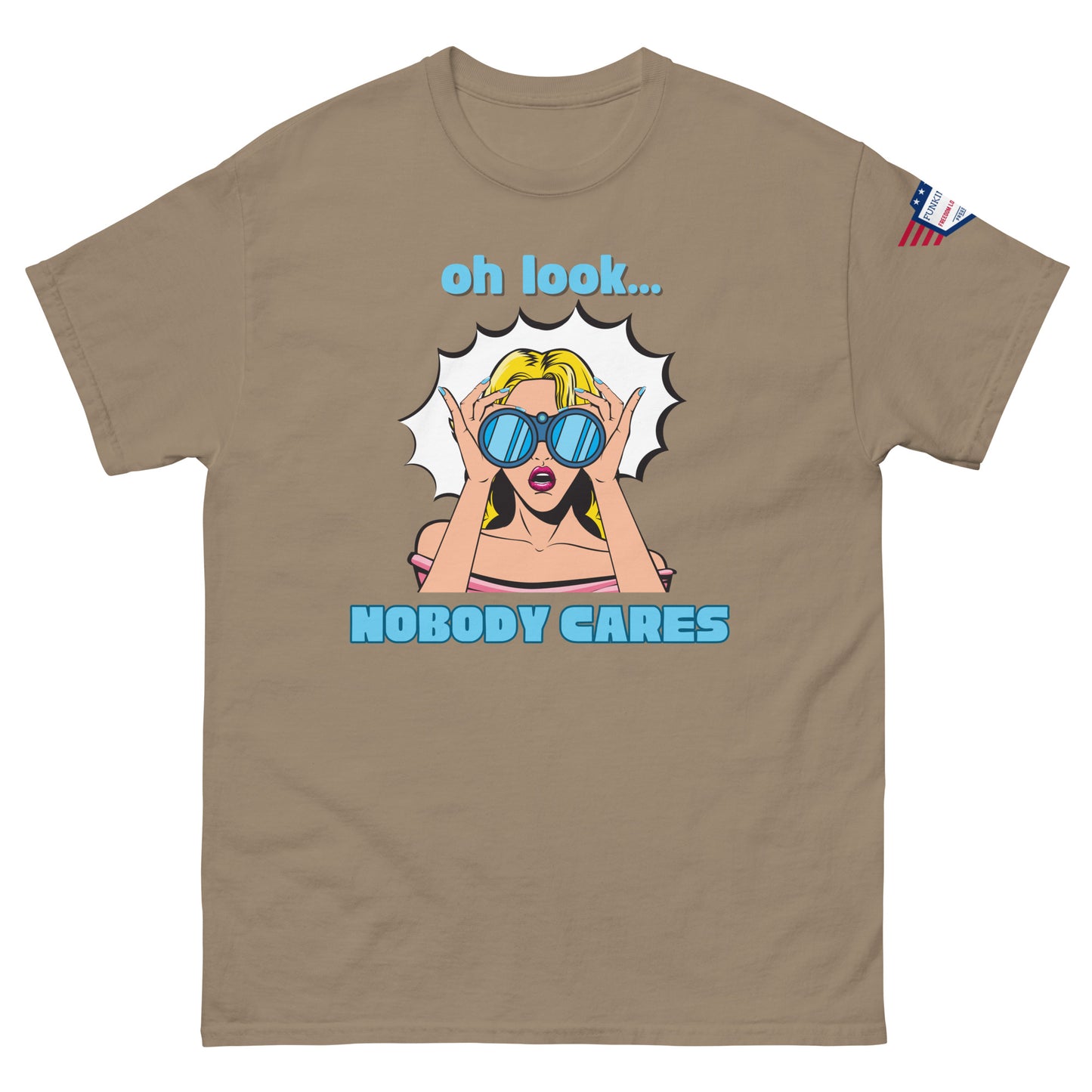 Front view of tan unisex t-shirt with cyan "Oh look..." text, pop-art blonde diva in blue shades yelling "NOBODY CARES", USA flag sleeve patch