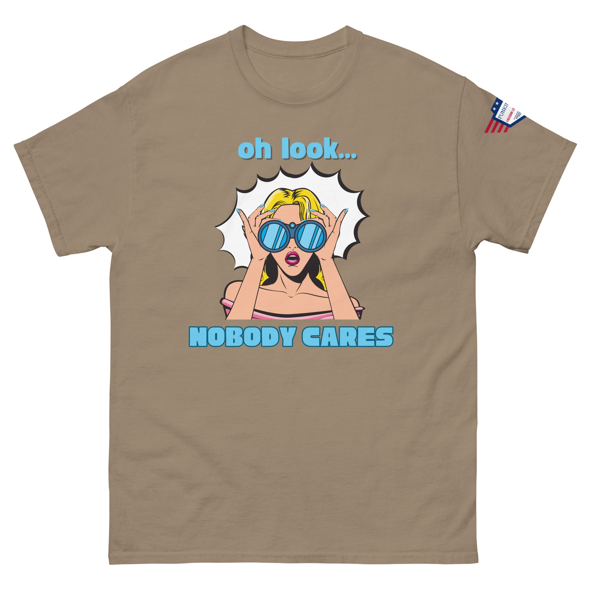 Front view of tan unisex t-shirt with cyan "Oh look..." text, pop-art blonde diva in blue shades yelling "NOBODY CARES", USA flag sleeve patch