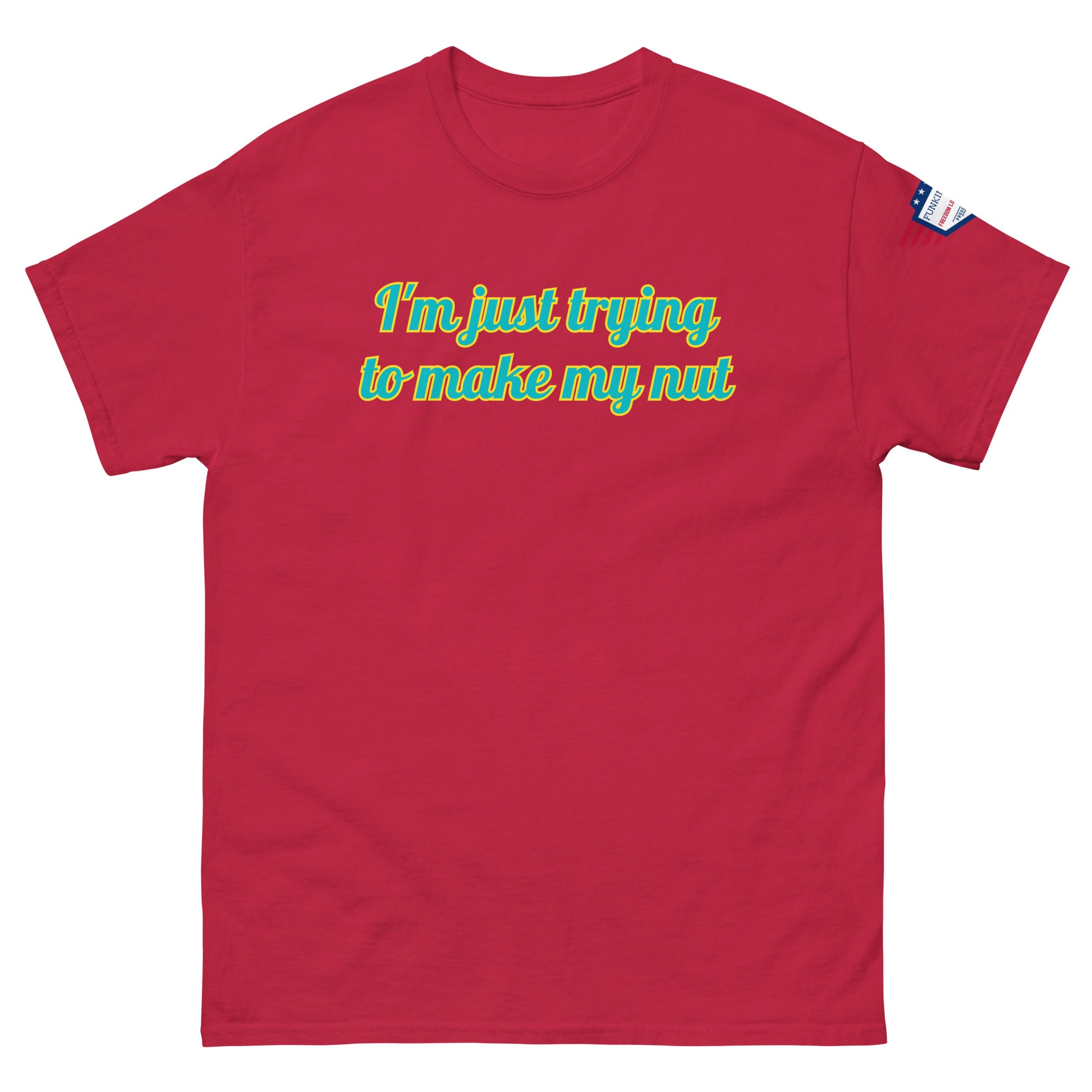 Front view of red unisex tee declaring "I'm just trying to make my nut" in teal script, US flag detail