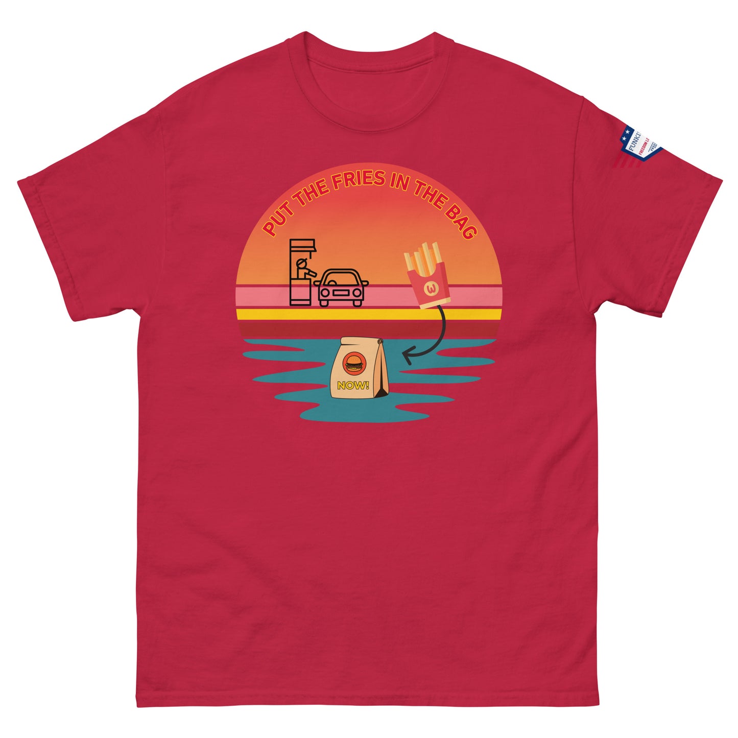 Front view of red unisex T-shirt with "Put the fries in the bag" colorful sunset drive-thru graphic and flag sleeve patch