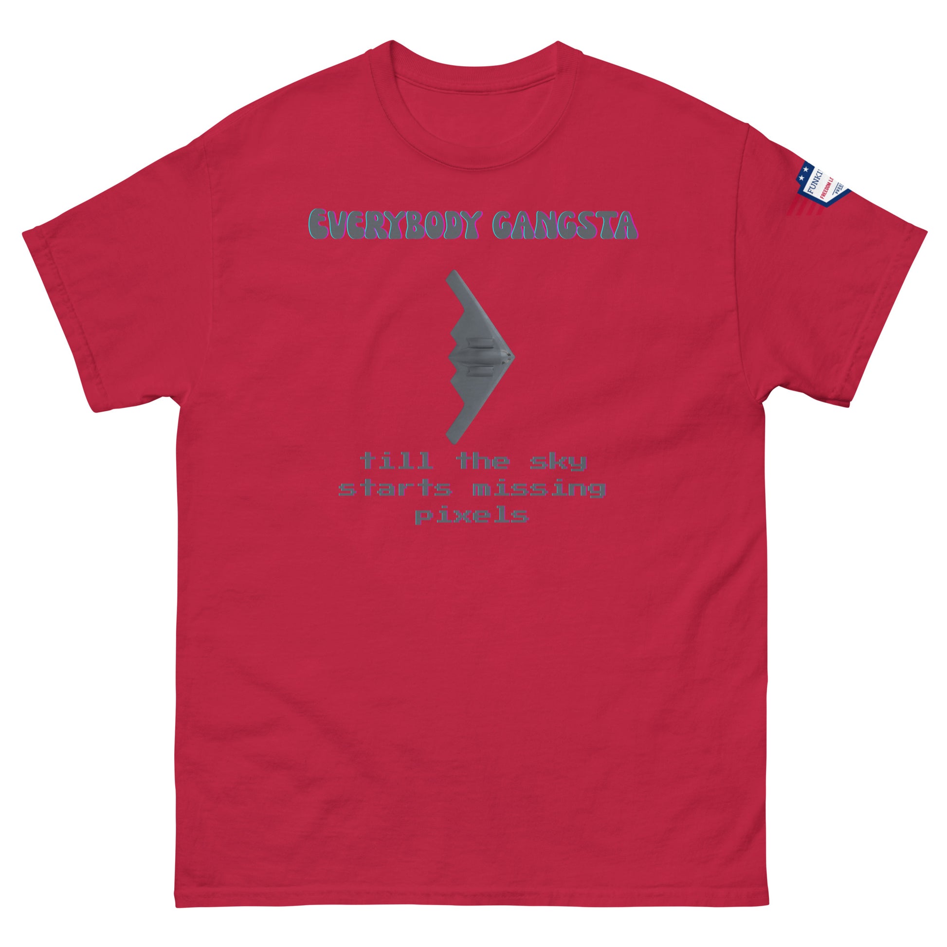 Front view of red unisex tee with purple "Everybody Gangsta" text, gray stealth bomber graphic, teal "till the sky starts missing pixels" glitch print, flag sleeve patch