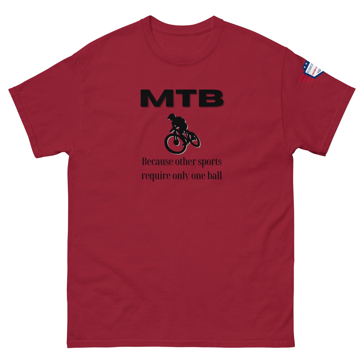 Front view of burgundy red classic unisex tee with bold black "MTB" print, biker silhouette, and "Because other sports require only one ball" text