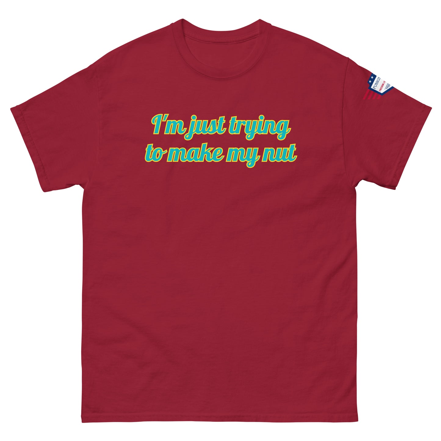 Front view of hot pink unisex tee with "I'm just trying to make my nut" in teal-yellow cursive print, US flag sleeve patch