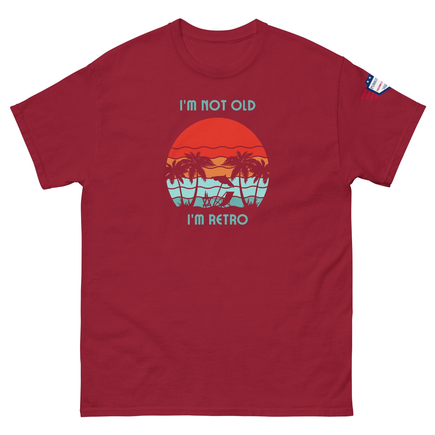 Front view of maroon unisex t-shirt with "I'm not old I'm retro" palm-fringed red sun graphic