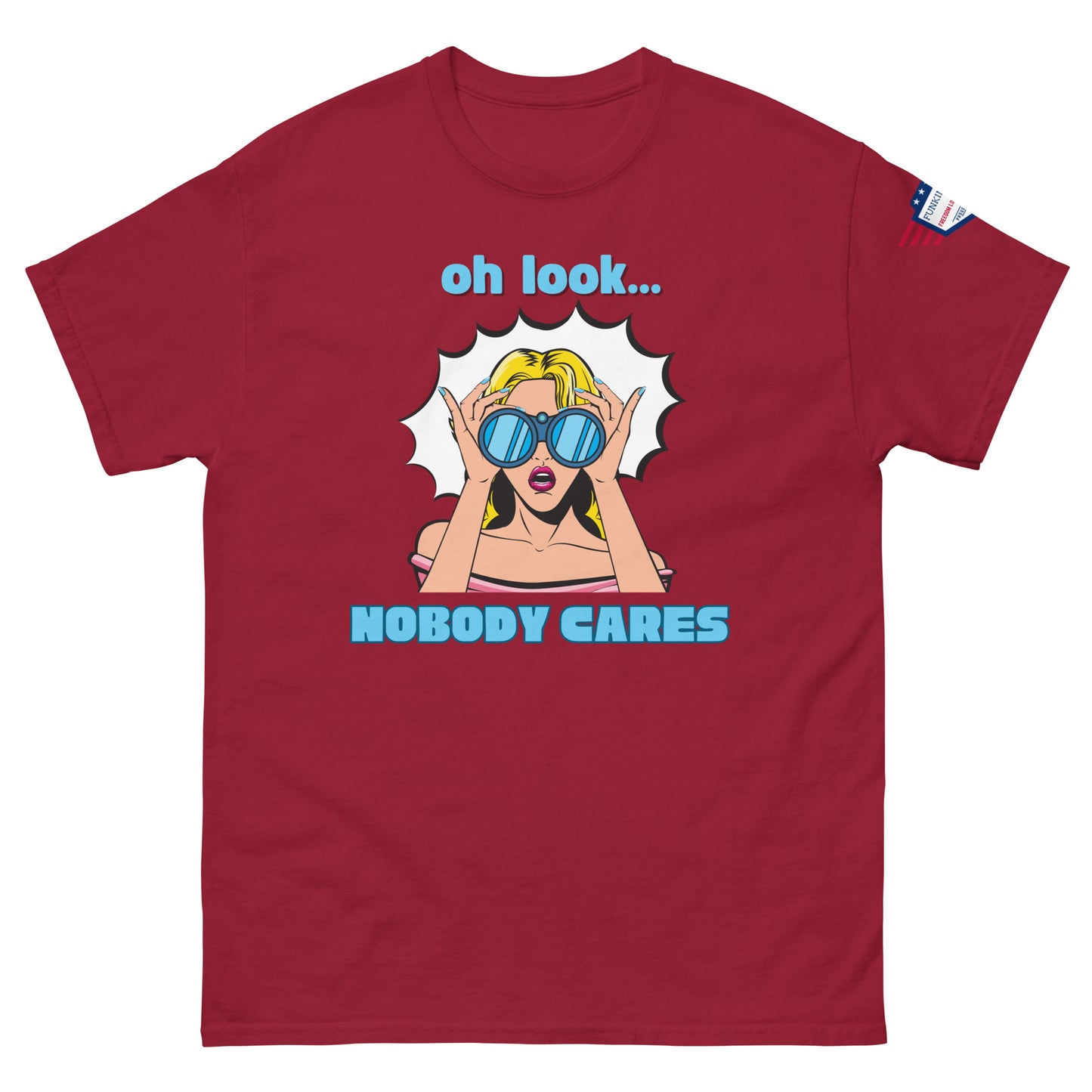 Front view of burgundy red unisex t-shirt showing "oh look... NOBODY CARES" pop art sunglasses babe and USA patch