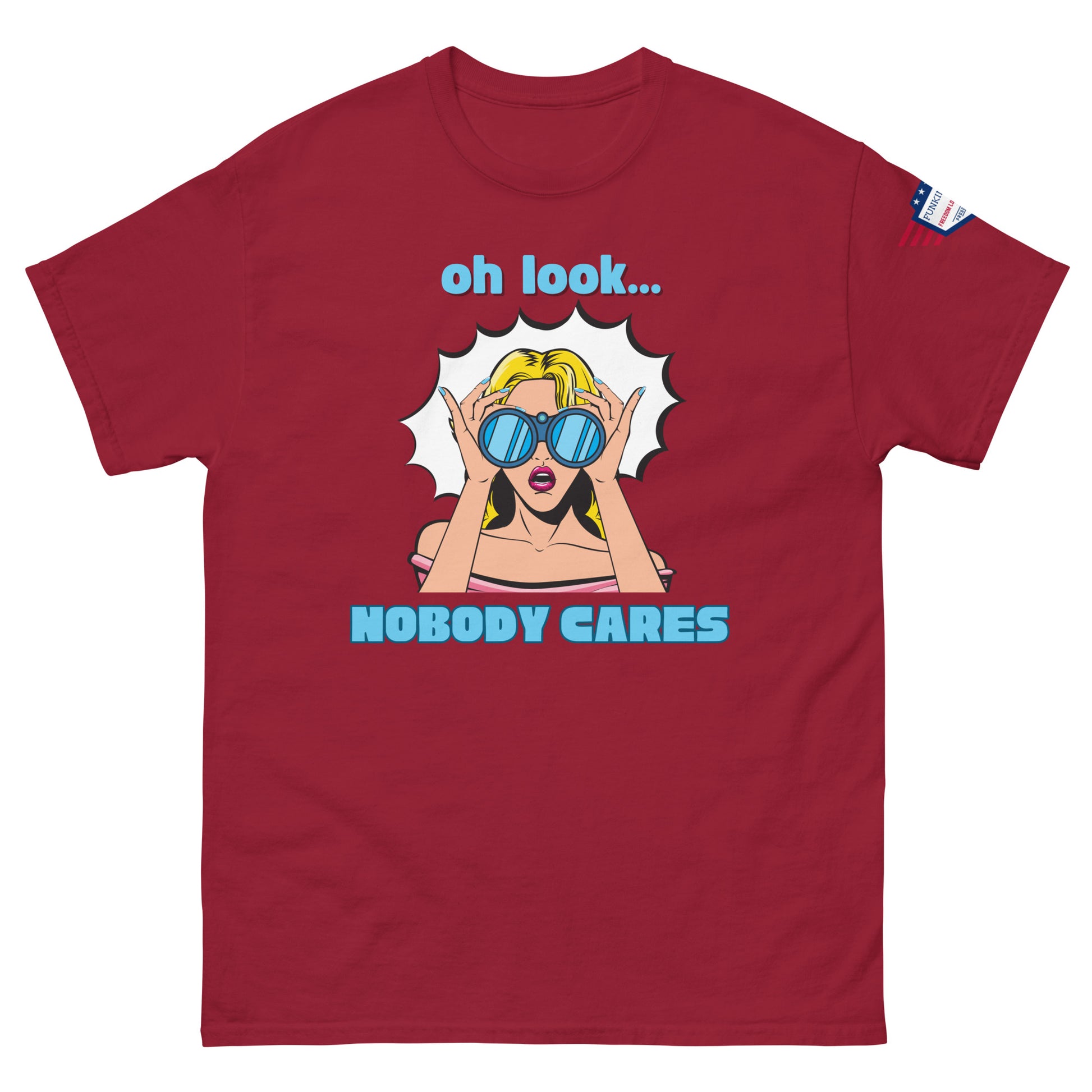 Front view of burgundy red unisex t-shirt showing "oh look... NOBODY CARES" pop art sunglasses babe and USA patch