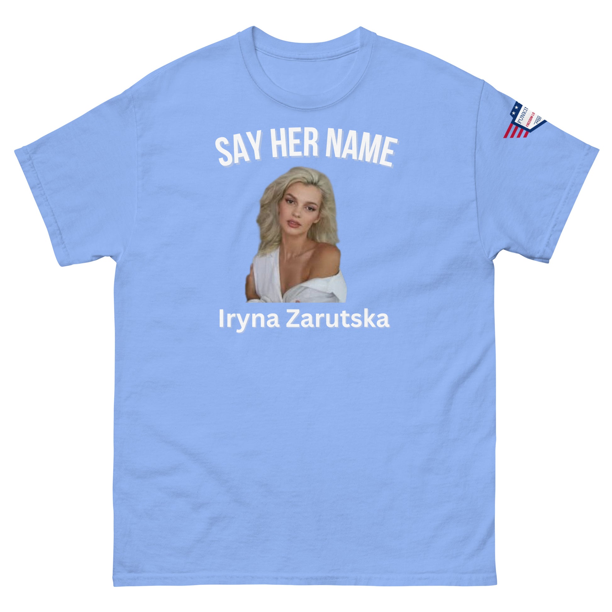 Front view of light blue "SAY HER NAME" tee with Iryna Zaruska portrait, USA sleeve patch